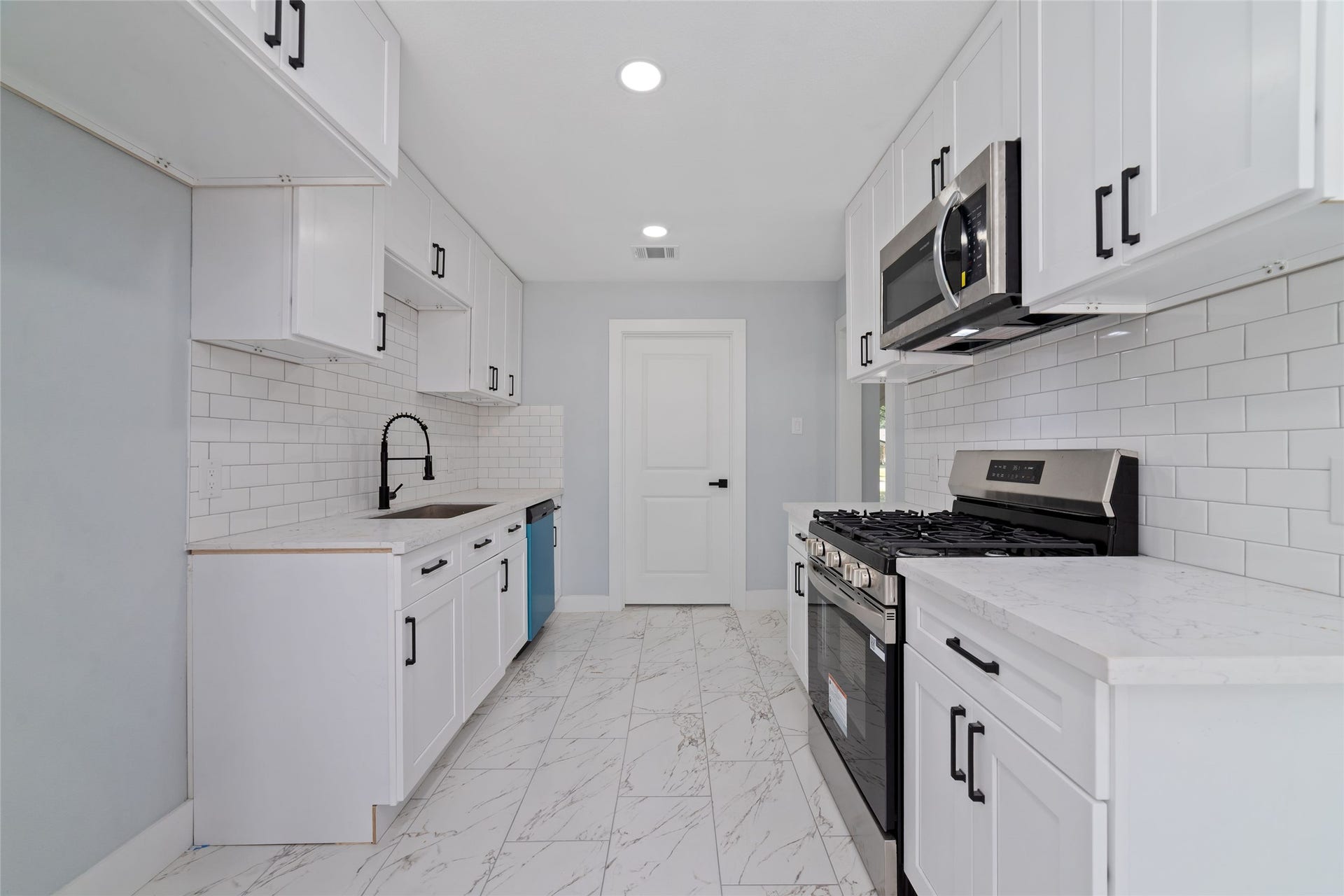 The kitchen provides a welcoming setting for meal preparation, morning routines, and everyday cooking.
