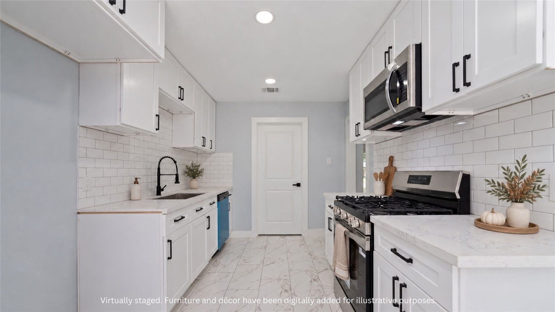 Virtually staged kitchen featuring white cabinetry, subway tile backsplash, contrasting hardware and a gas range. Dcor digitally added for illustration.