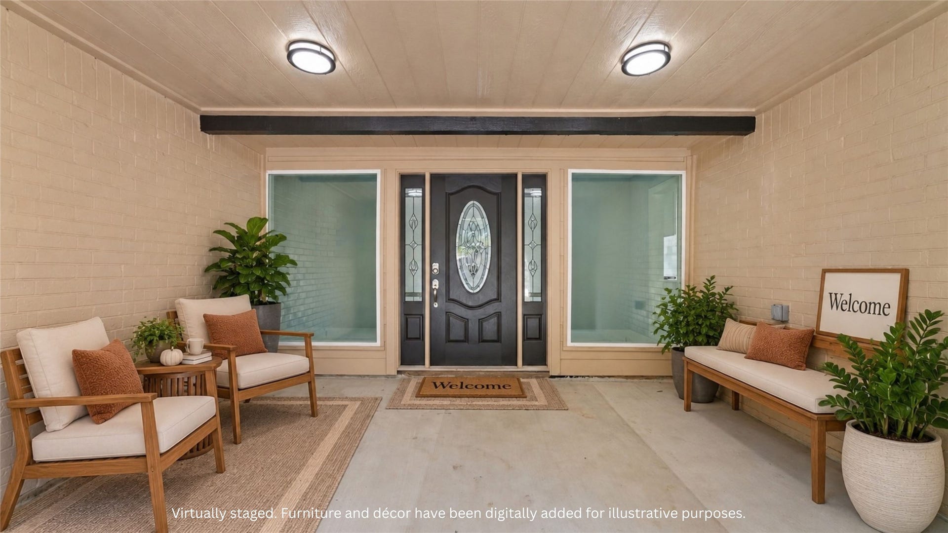 Virtually staged covered front porch with a suggested seating arrangement beside the decorative entry door. Furnishings and dcor digitally added for illustration.