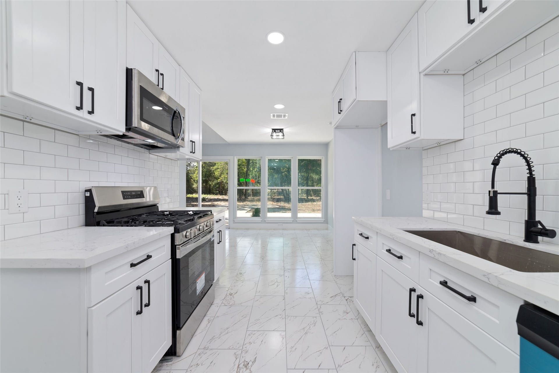 The kitchen provides a welcoming setting for meal preparation, morning routines, and everyday cooking.