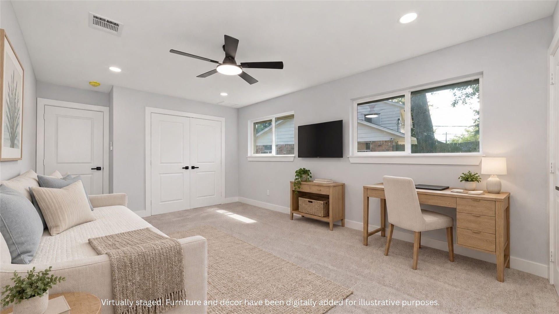 Virtually staged room illustrating an alternate arrangement with seating, a desk and a media area. Furnishings and dcor digitally added for illustration.