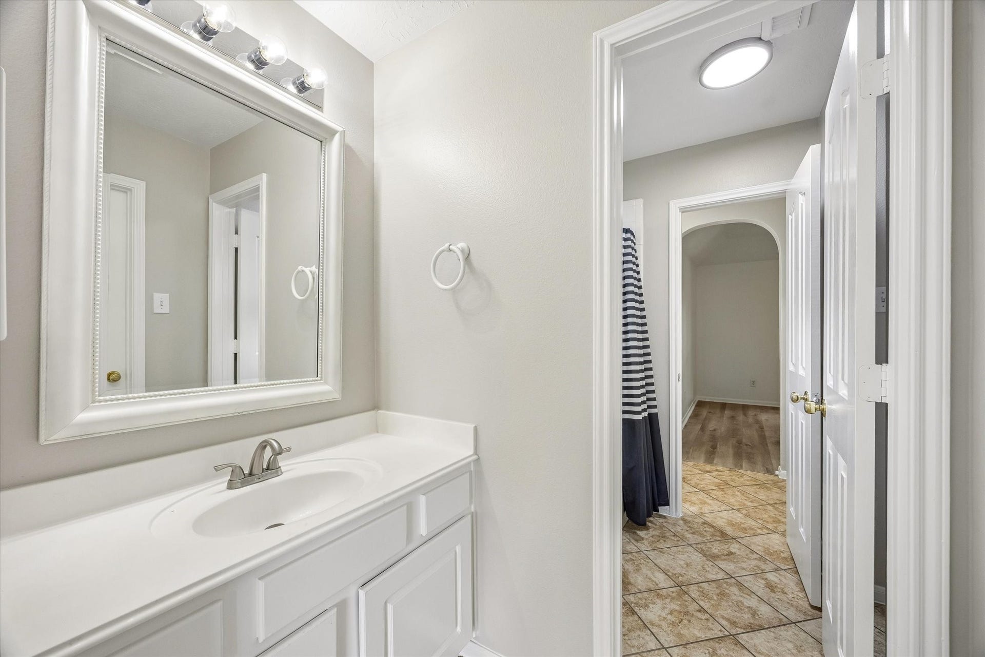 A convenient upstairs vanity provides extra space for busy mornings.