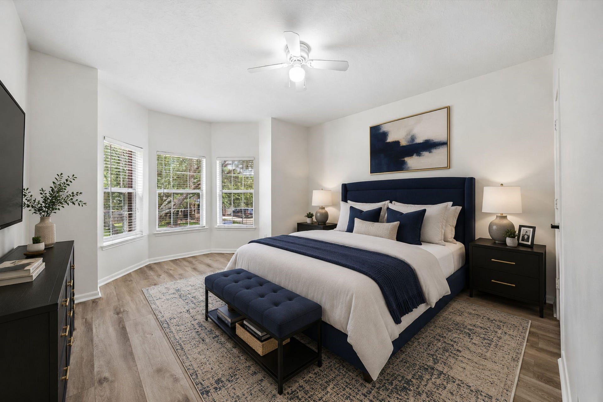 A spacious secondary bedroom features large windows and plenty of room for furniture. **Virtually Stage.