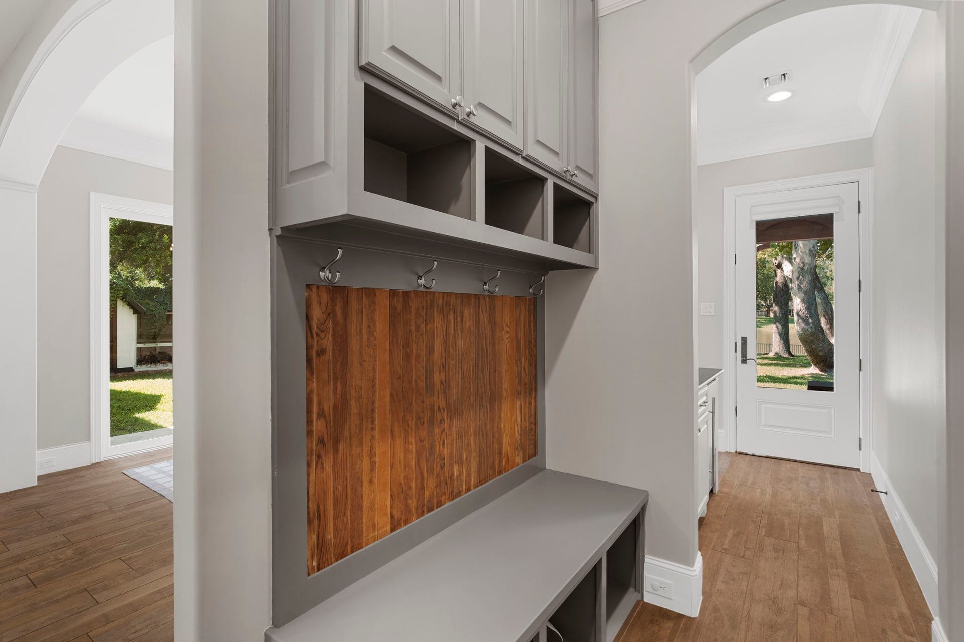 706 Oyster Creek Drive, Sugar Land, TX 77478 Built-in coat racks and cubbies create the perfect drop zone for shoes, hats, coats, and everyday essentialsideal for keeping a busy family organized.