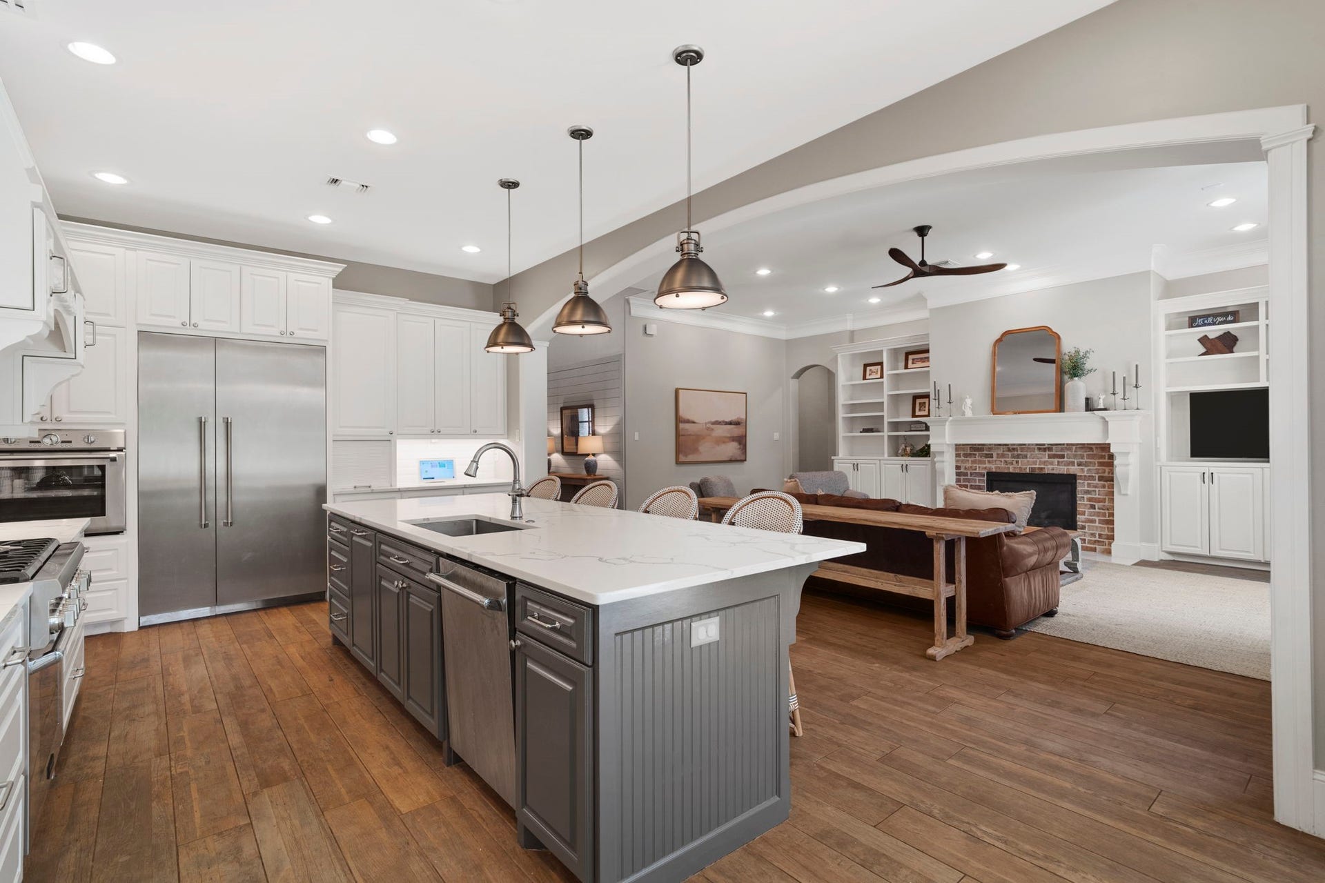 706 Oyster Creek Drive, Sugar Land, TX 77478 Built-in Thermador side-by-side refrigerator offers generous storage and an integrated look that complements the custom kitchen design.