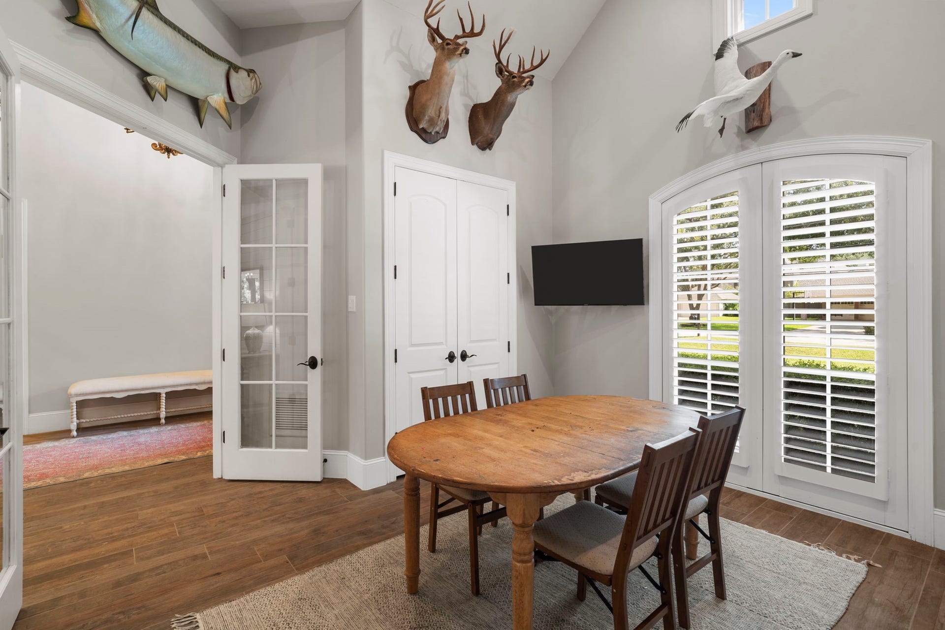 706 Oyster Creek Drive, Sugar Land, TX 77478 The office also features a large arched window with plantation shutters and a double-door storage closet.