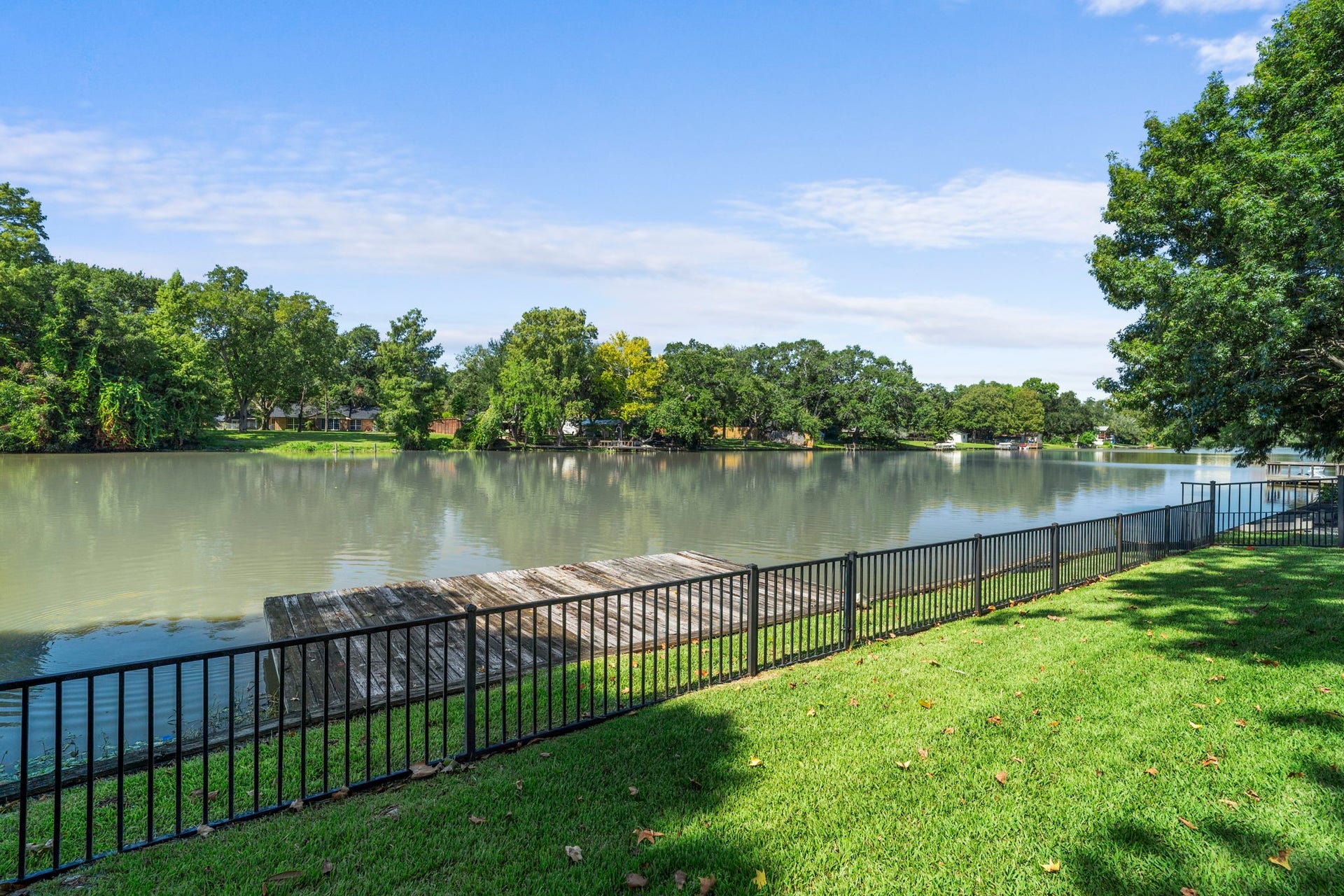 706 Oyster Creek Drive, Sugar Land, TX 77478 Launch a kayak or canoe from your own private dock and enjoy beautiful water views from the fully fenced backyard. The metal fencing provides security for pets and children while preserving the open waterfront views.