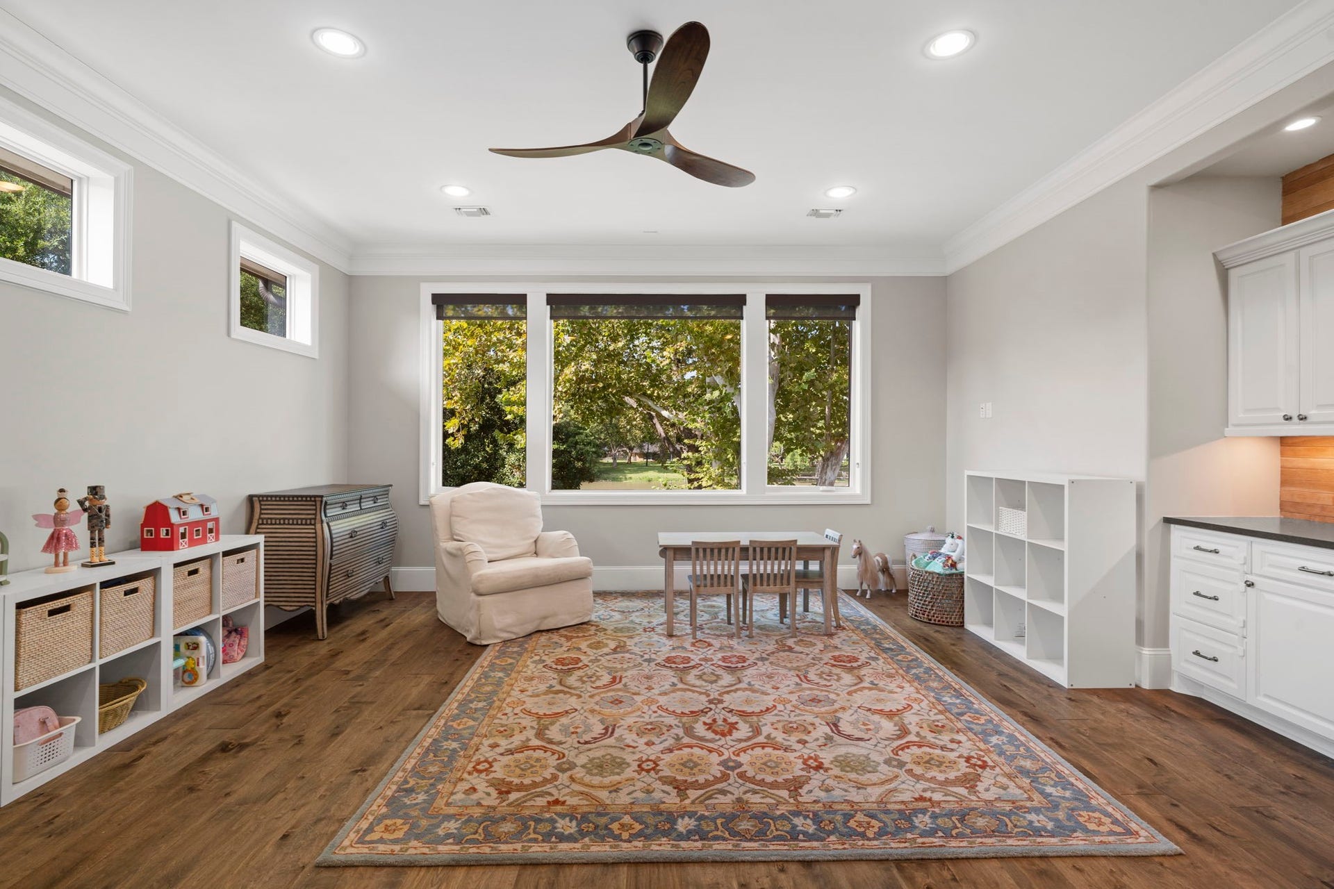 706 Oyster Creek Drive, Sugar Land, TX 77478 The Game Room features wood flooring and built-in cabinetry, offering a versatile upstairs retreat that can be used as a private living room, homeschool room, second home office, workout space, or whatever best fits your lifestyle.