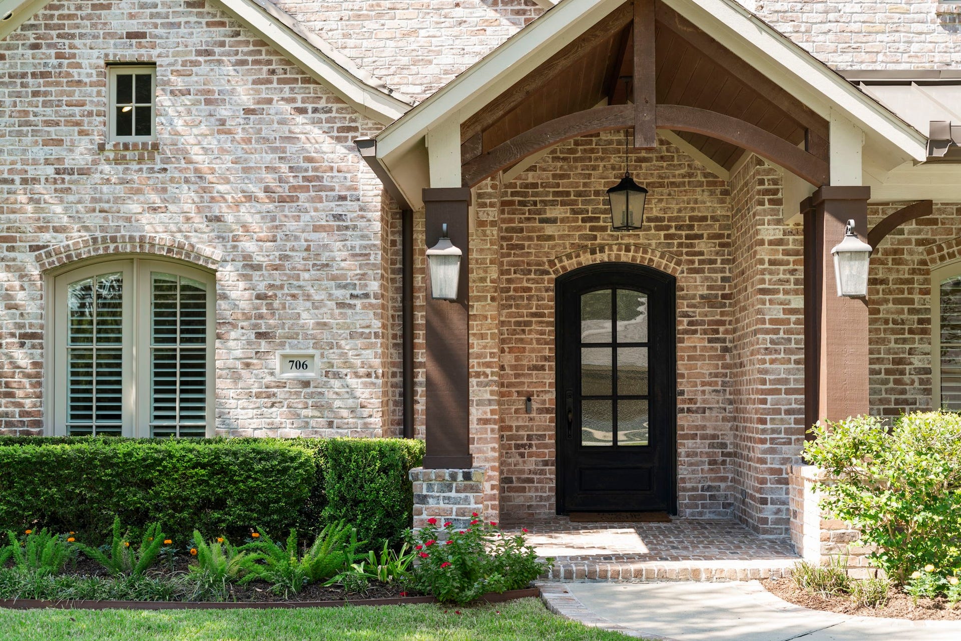 706 Oyster Creek Drive, Sugar Land, TX 77478 This Modern English Cottagestyle home exudes timeless charm, blending natural brick and wood with exquisite craftsmanship and thoughtful architectural details.