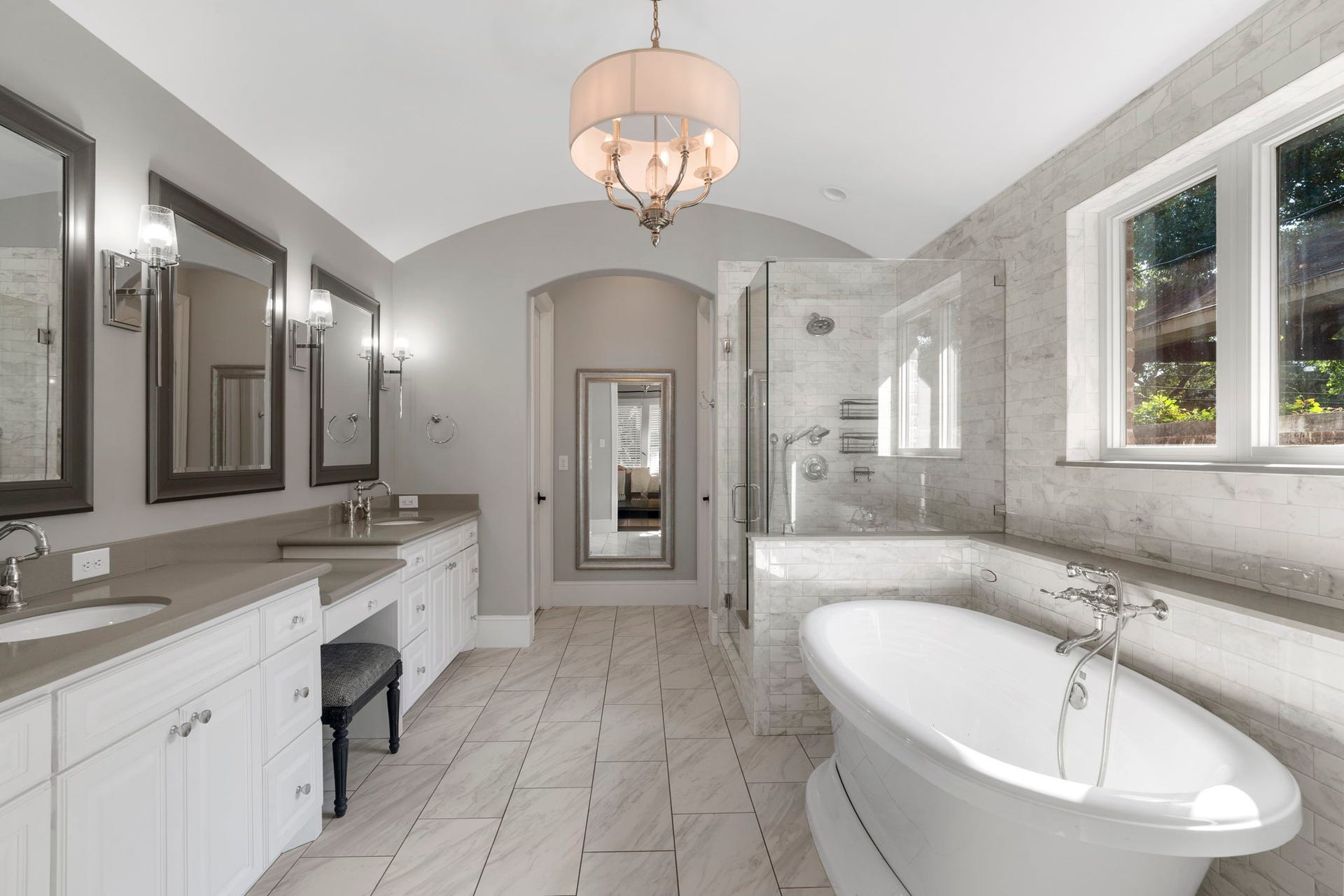 706 Oyster Creek Drive, Sugar Land, TX 77478 Architectural details take center stage in the owners bath, where a barrel-vaulted ceiling and graceful arched doorways set the tone.