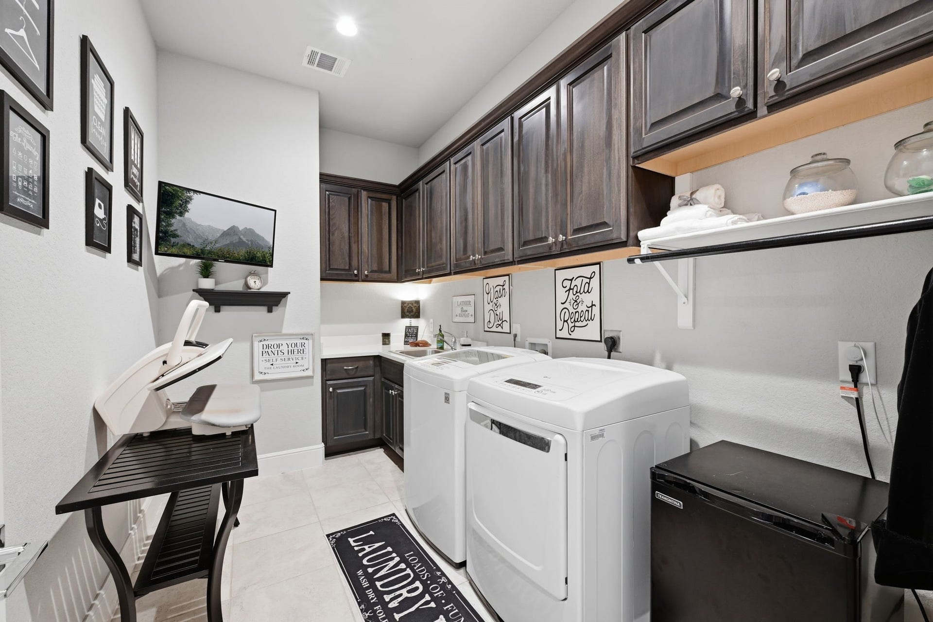 4043 Woodland Meadow Drive, Spring, TX 77386 Laundry room with ample cabinetry.