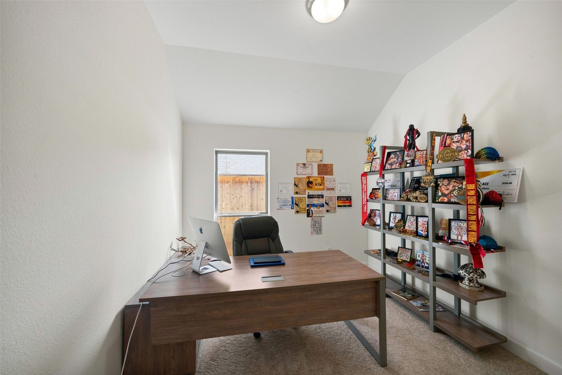 118 Sierra Stream Court, Conroe, TX 77304 Private home office offers a quiet, dedicated workspace with high ceilings, natural light, and ample room for a substantial desk and shelving. This versatile room is ideal for working from home or pursuing creative interests.