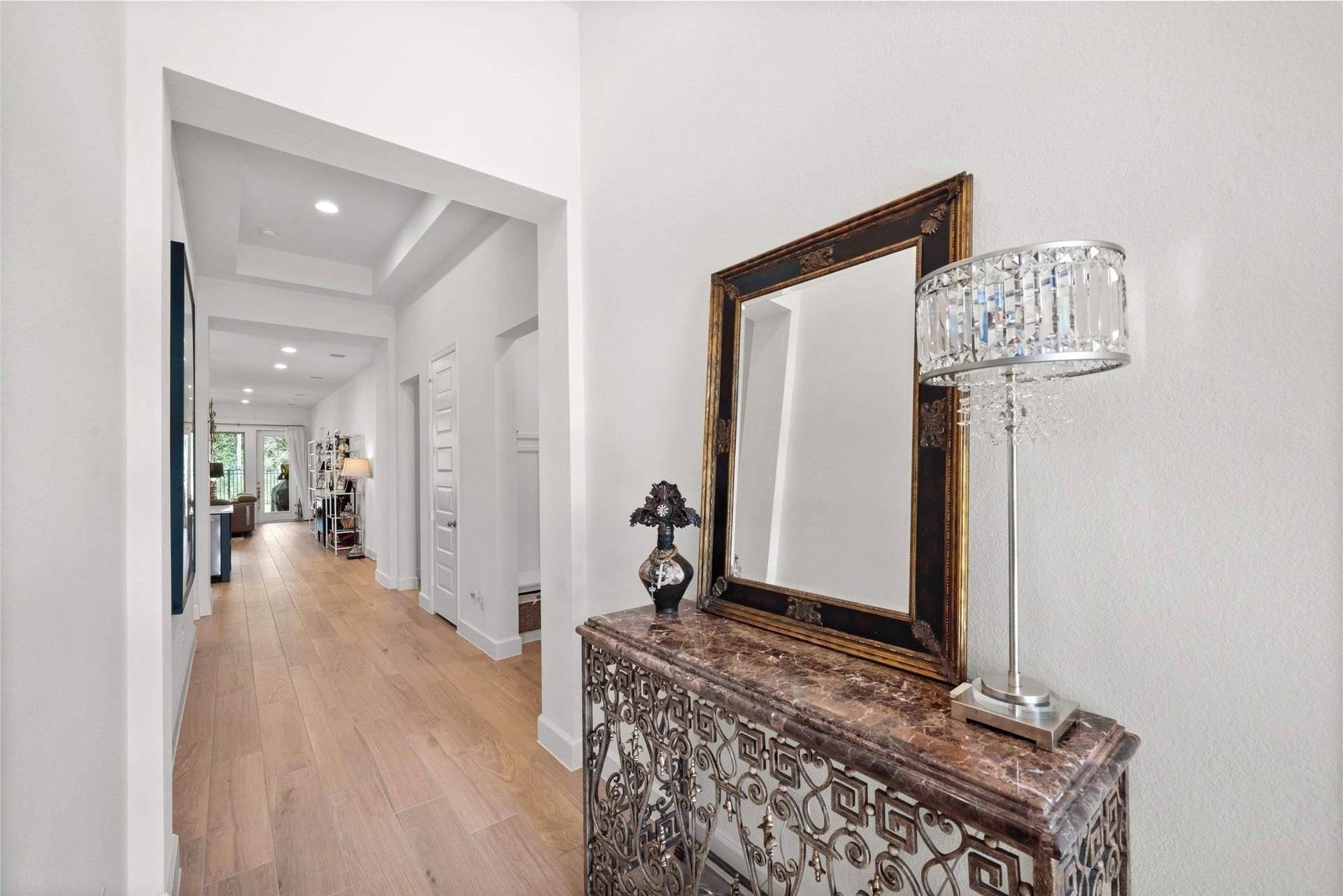 118 Sierra Stream Court, Conroe, TX 77304 Welcoming entryway features soaring ceilings, beautiful wood-look flooring, and an elegant architectural transition into the home's main living areas. The spacious layout offers an inviting introduction to the thoughtfully designed interior.