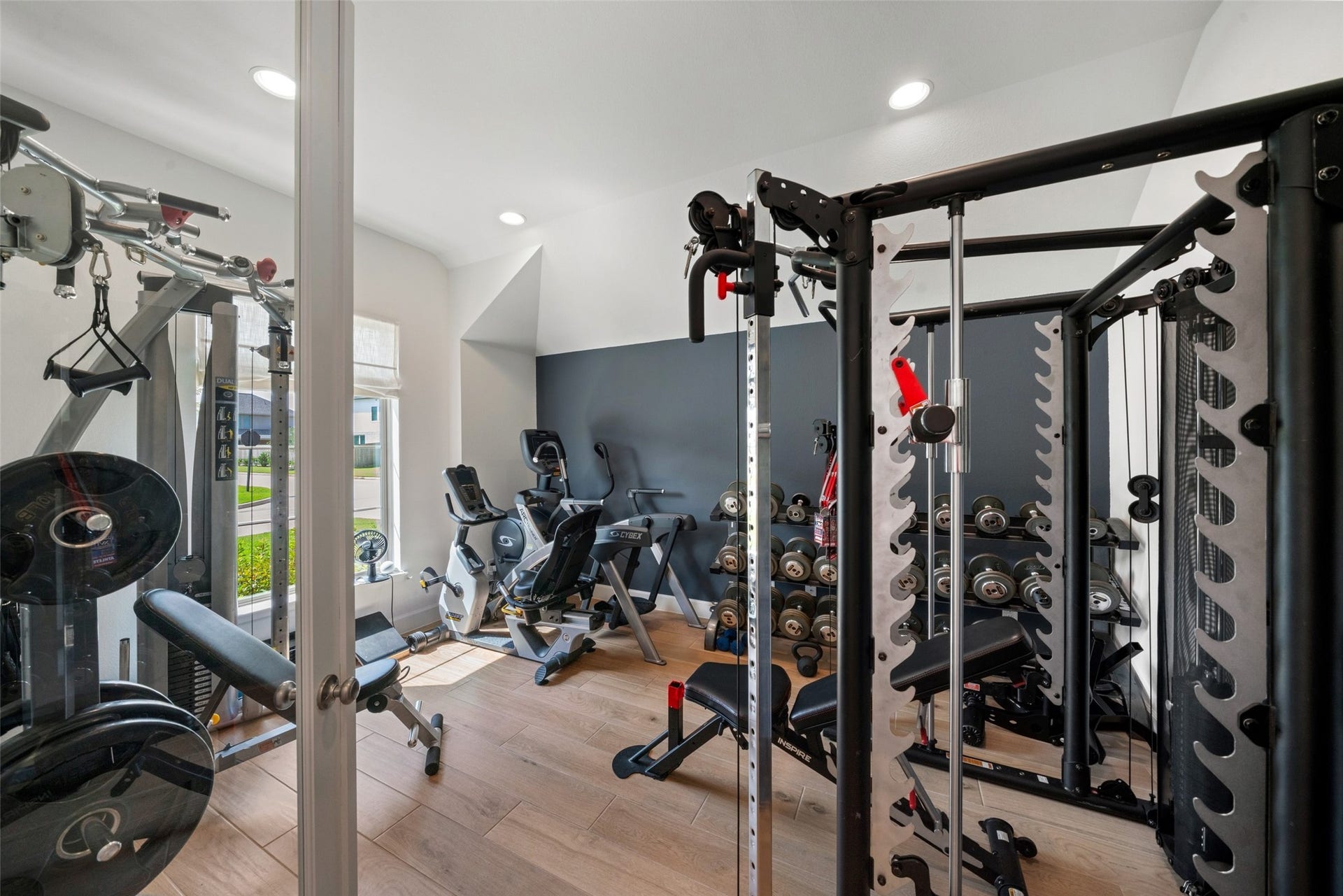 118 Sierra Stream Court, Conroe, TX 77304 Versatile exercise room-flex room offers an exceptional opportunity for a dedicated home fitness studio. Generous space for strength training and cardio equipment, abundant natural light, and attractive flooring create an ideal workout environment.