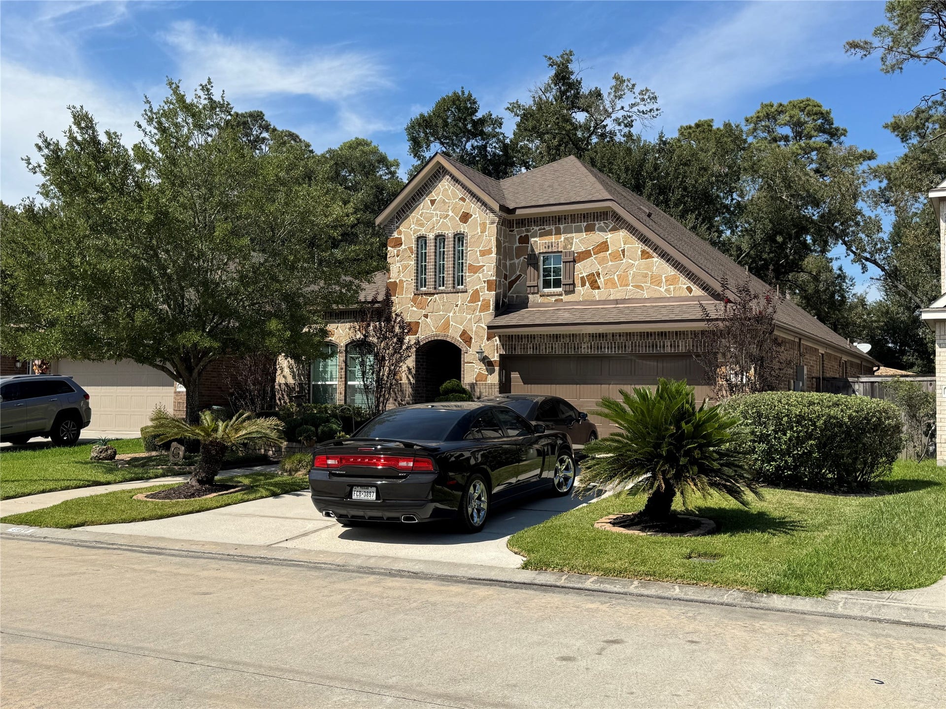 4910 Woodbury Mill Drive, Spring, TX 77389 Beautiful stone faade with windows for natural light in the attic space.