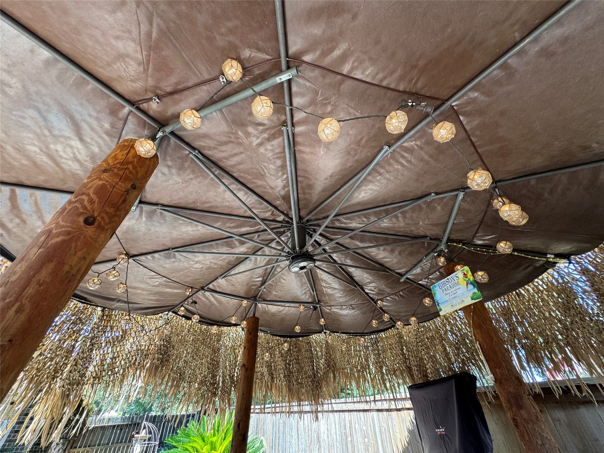 4910 Woodbury Mill Drive, Spring, TX 77389 Lighted palapa tops the outdoor kitchen