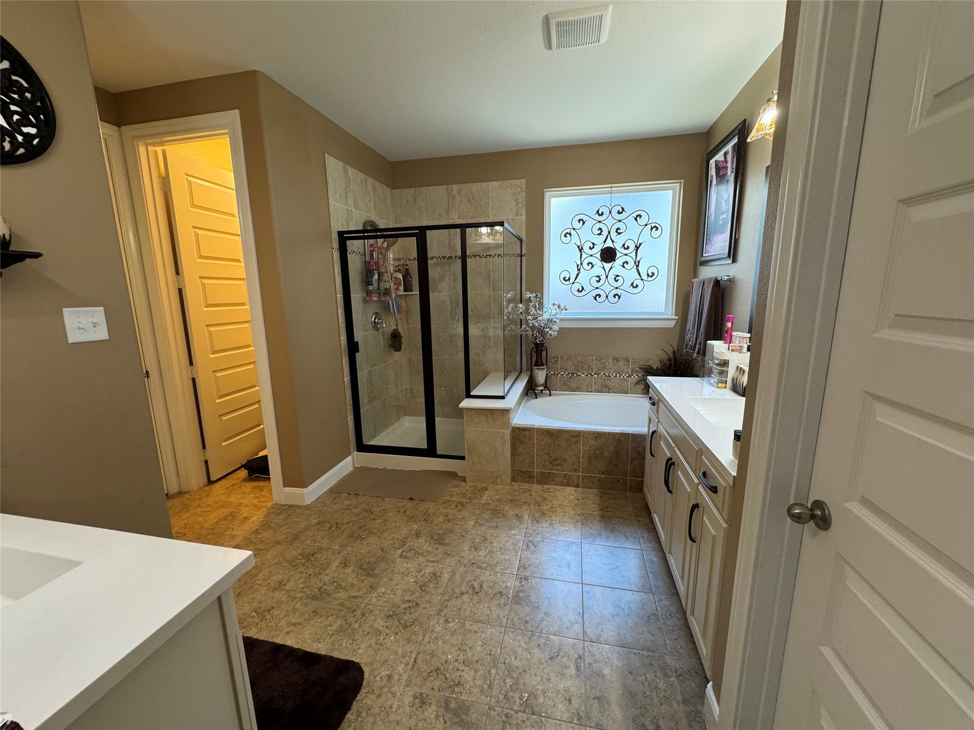 4910 Woodbury Mill Drive, Spring, TX 77389 Primary bathroom offers soaking tub with separate shower and toilet room.