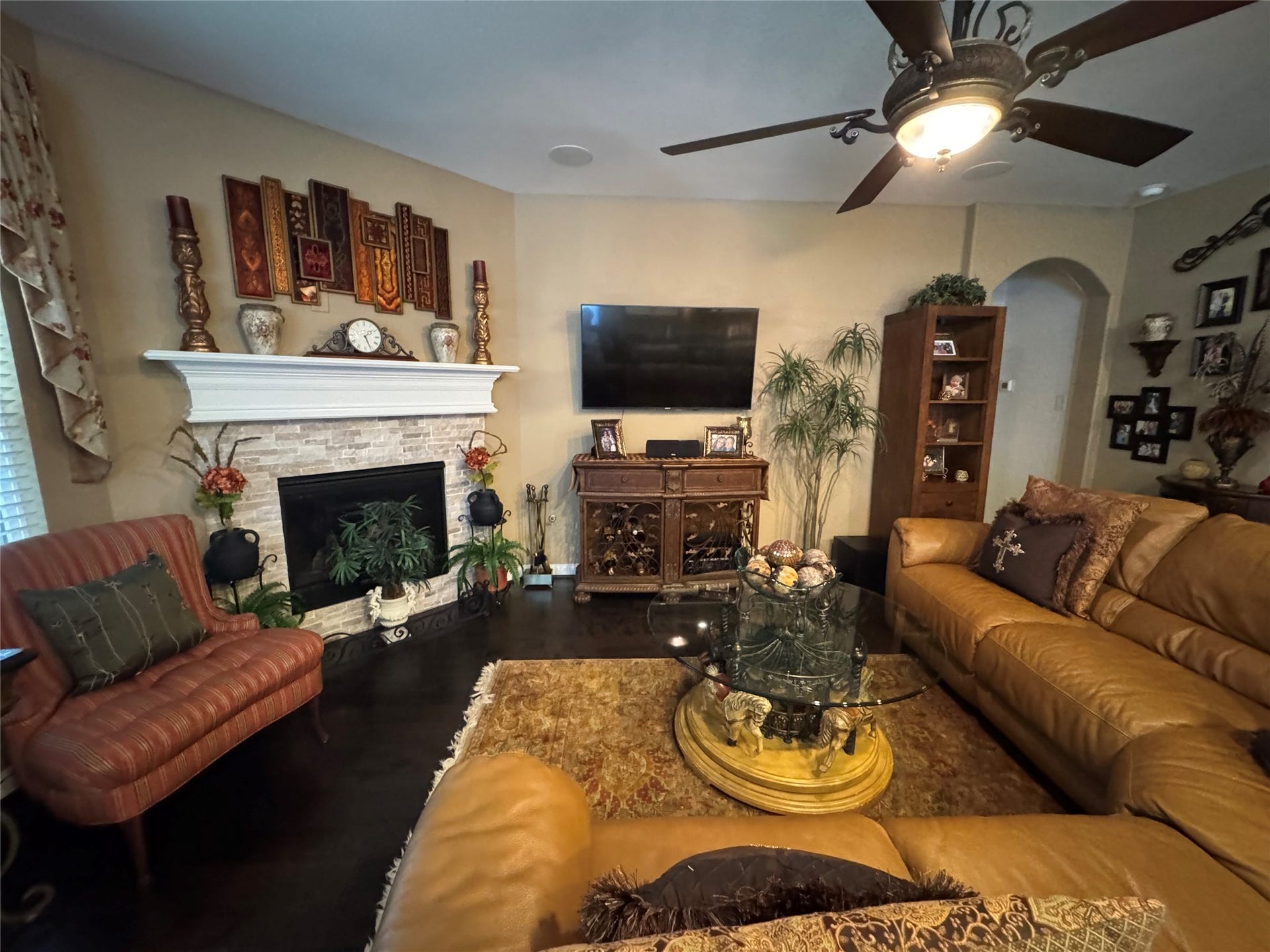 4910 Woodbury Mill Drive, Spring, TX 77389 Beautiful stone surrounds gas fireplace in the den