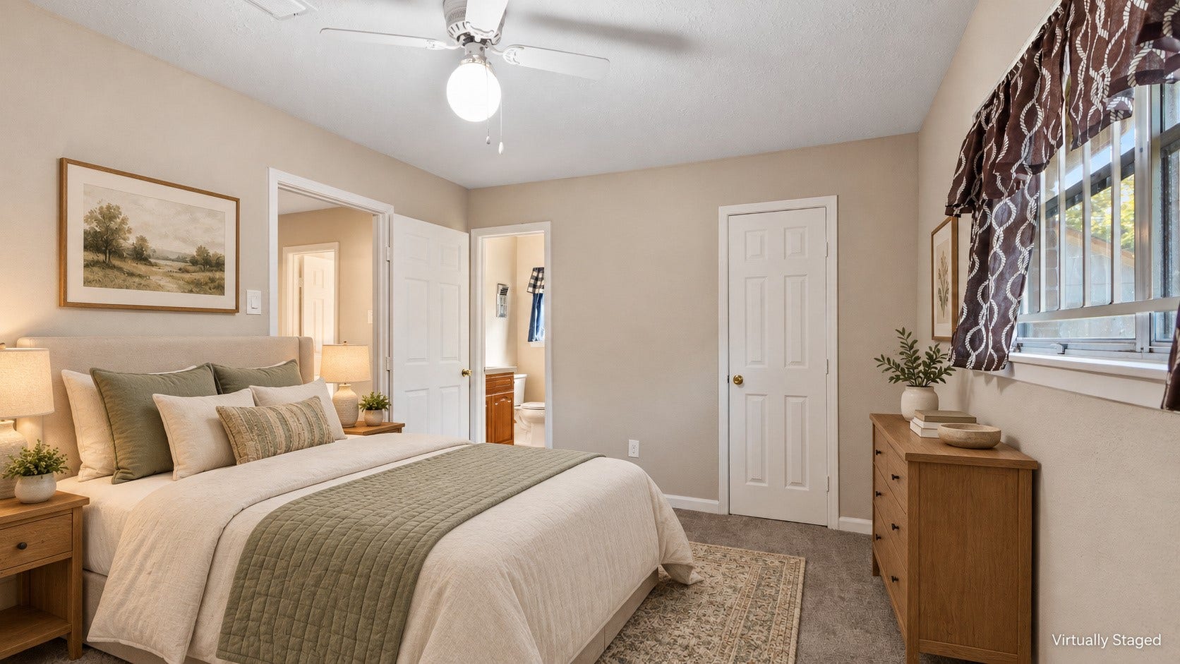 Virtually staged primary bedroom with soft, neutral bedding and adjoining bathroom access.