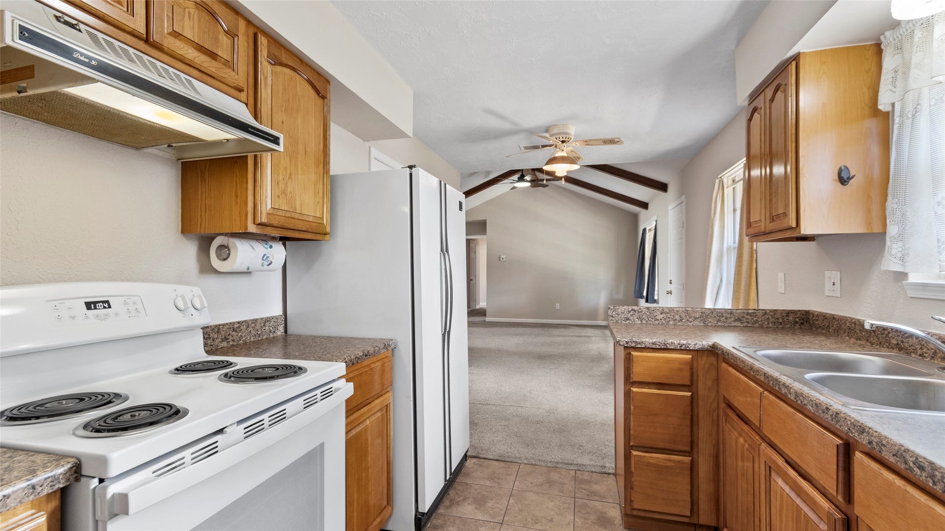 Kitchen overlooking the breakfast area and adjoining family room.