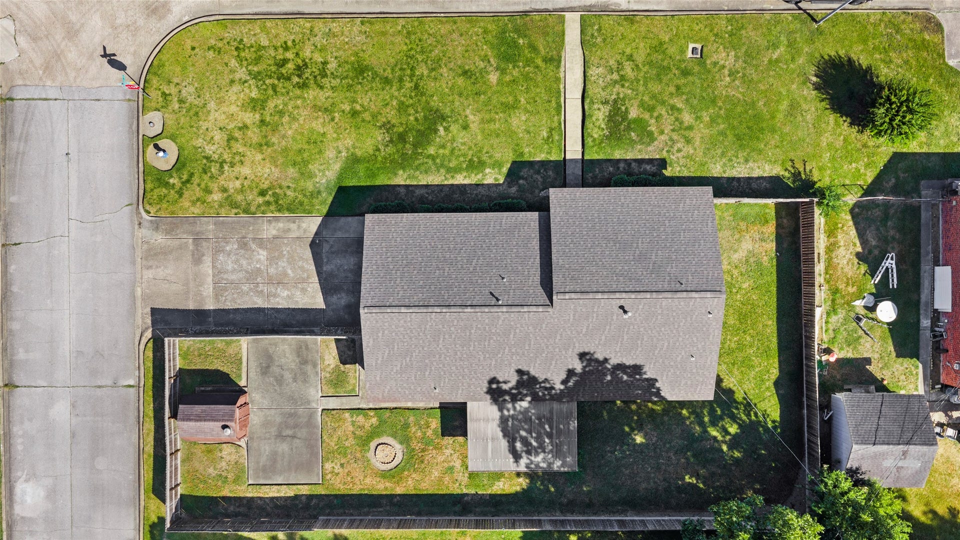 Overhead view highlighting the new roof and corner-lot layout.