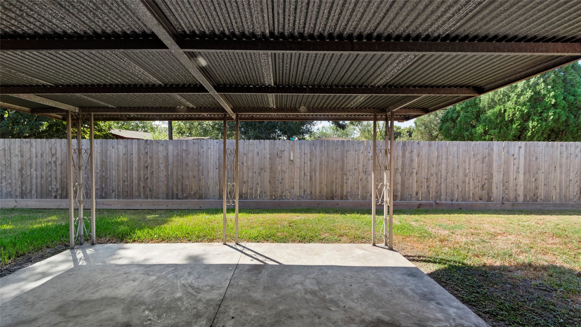 Covered patio with space for outdoor dining and relaxing.