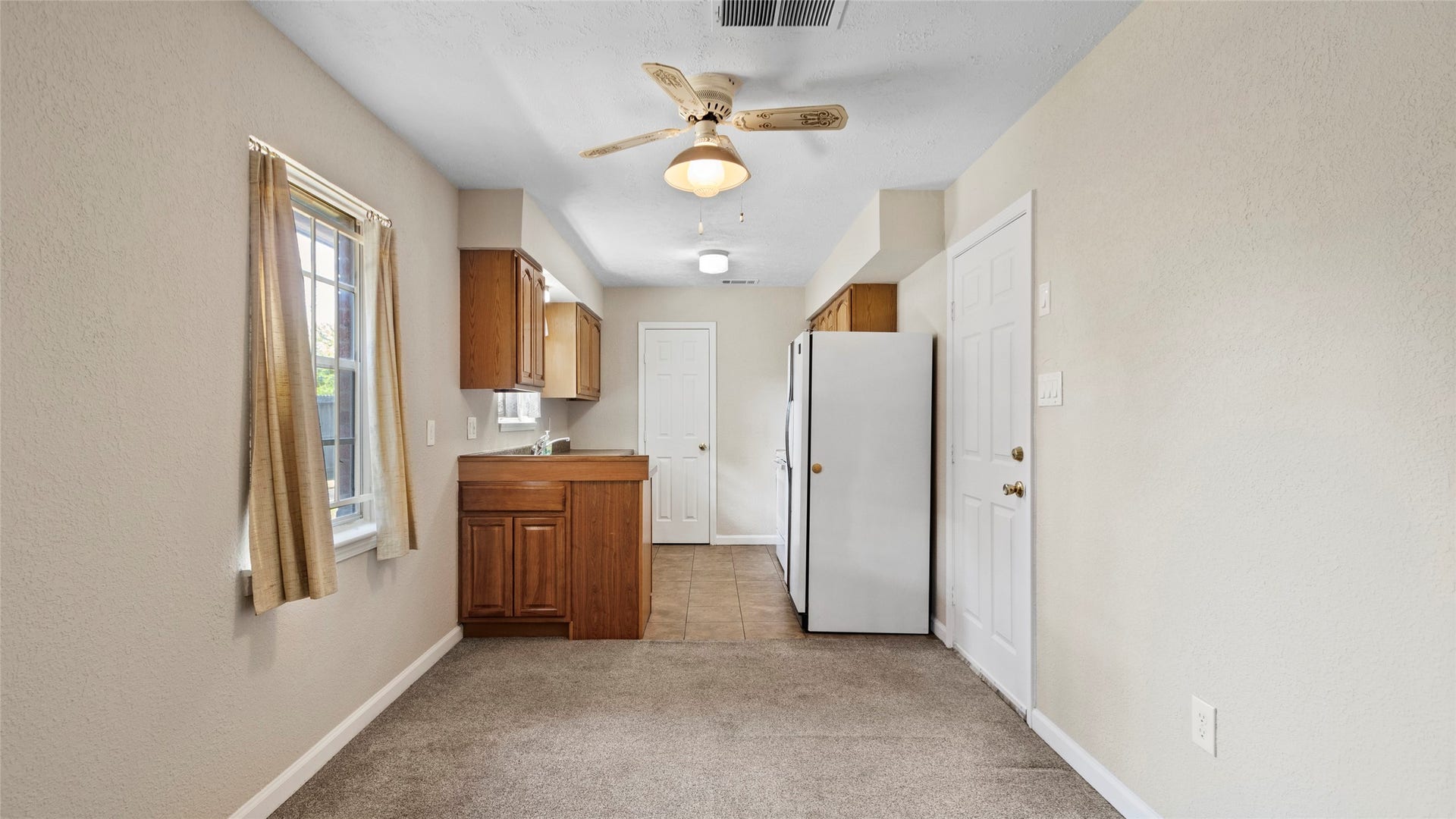 Kitchen overlooking the breakfast area and adjoining family room.