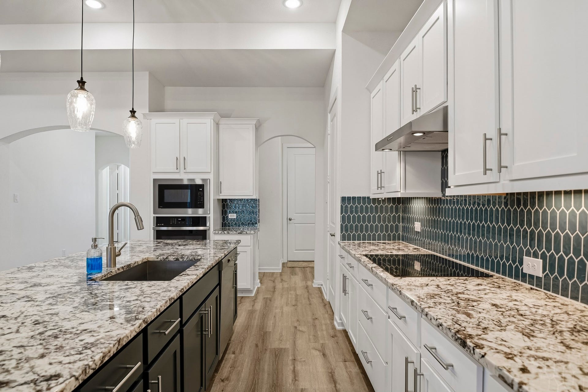 9527 Waxwing Trace, Manvel, TX 77578 Induction cooktop in counter.