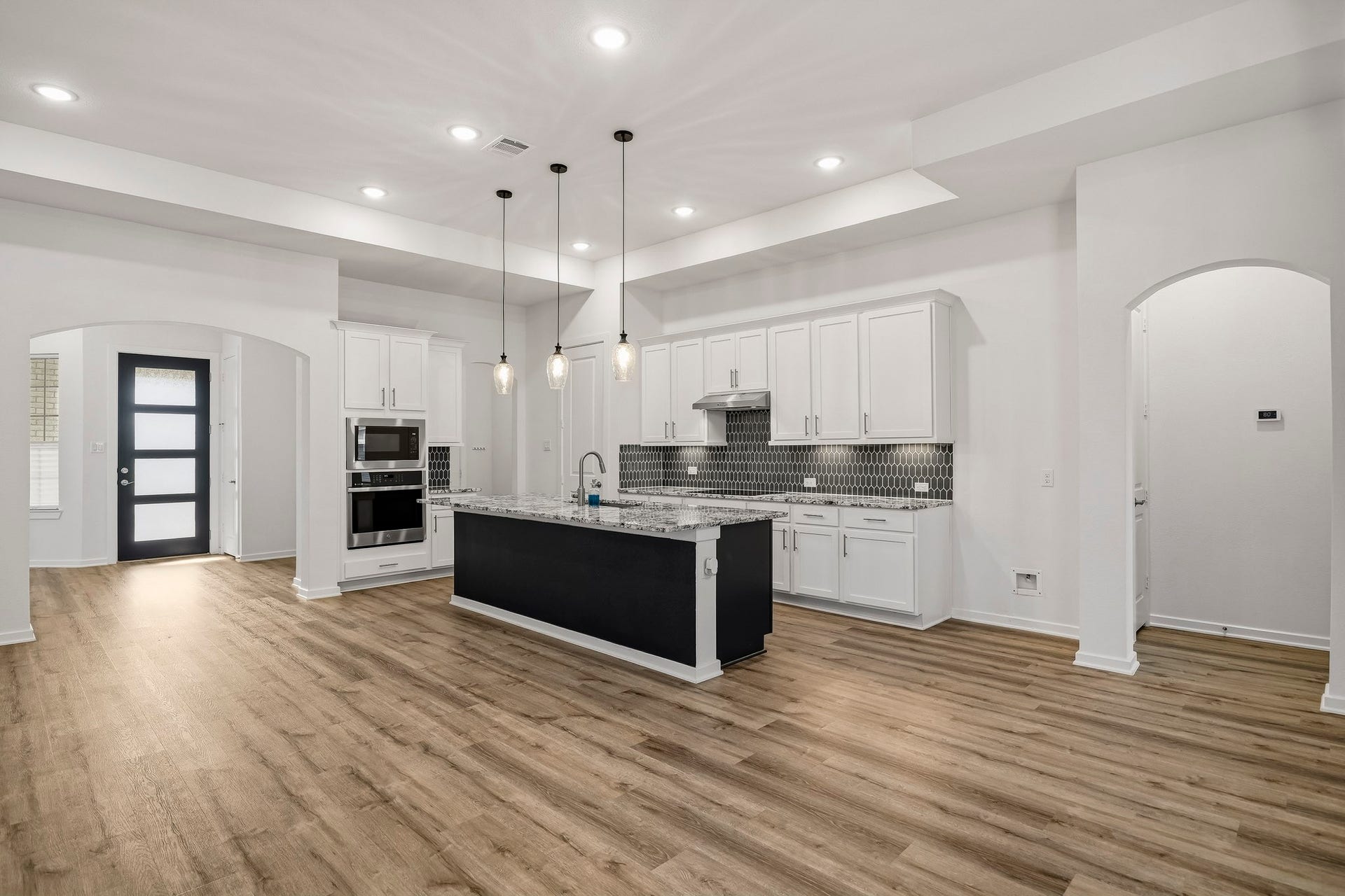 9527 Waxwing Trace, Manvel, TX 77578 Bottom kitchen cabinets have slide out drawers.