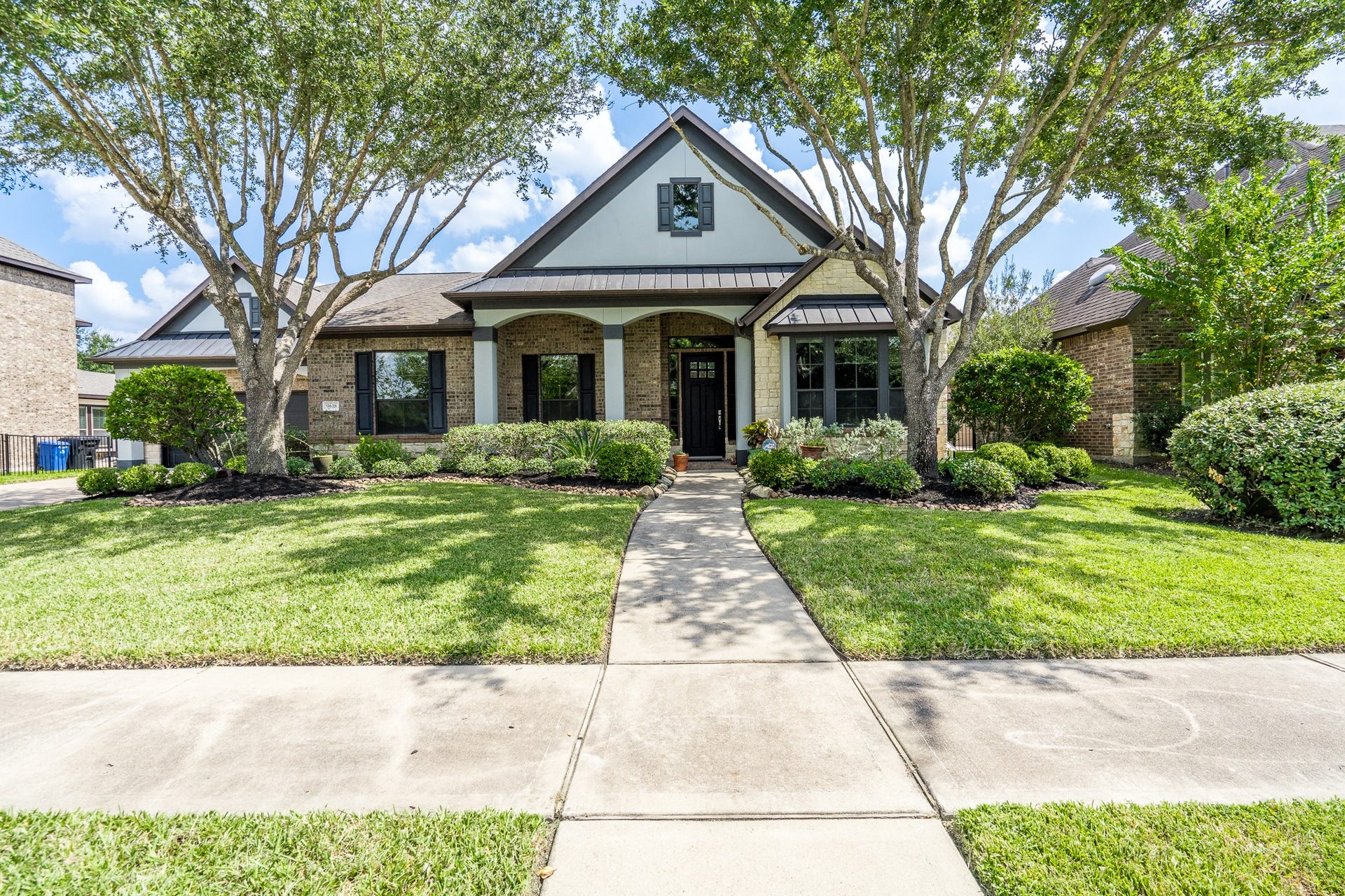 9618 W Pedernales River Drive, Cypress, TX 77433 Curb appeal galore with this Newmark built home. Exterior consists of stone, stucco and brick. Mature landscaping.