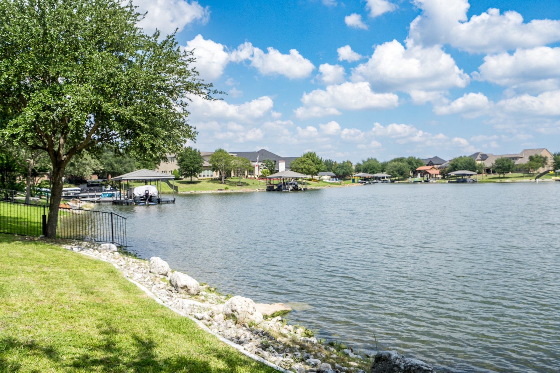 9618 W Pedernales River Drive, Cypress, TX 77433 Owners adding rock at the shoreline for erosion control.