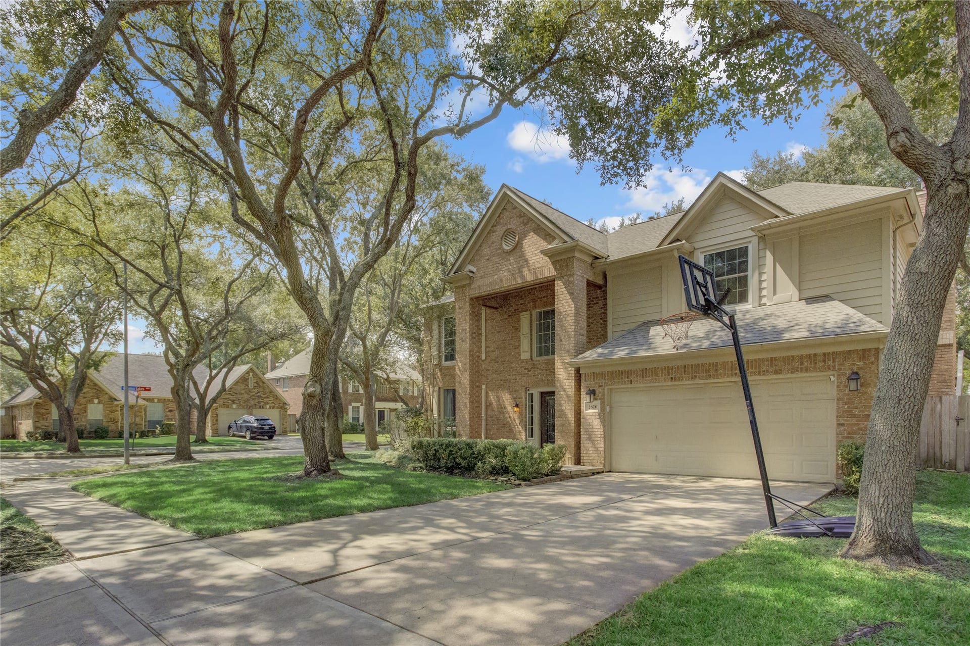 2826 Spring Lakes, Missouri City, TX 77459 Timeless brick, a welcoming front walk and a two-car garage.