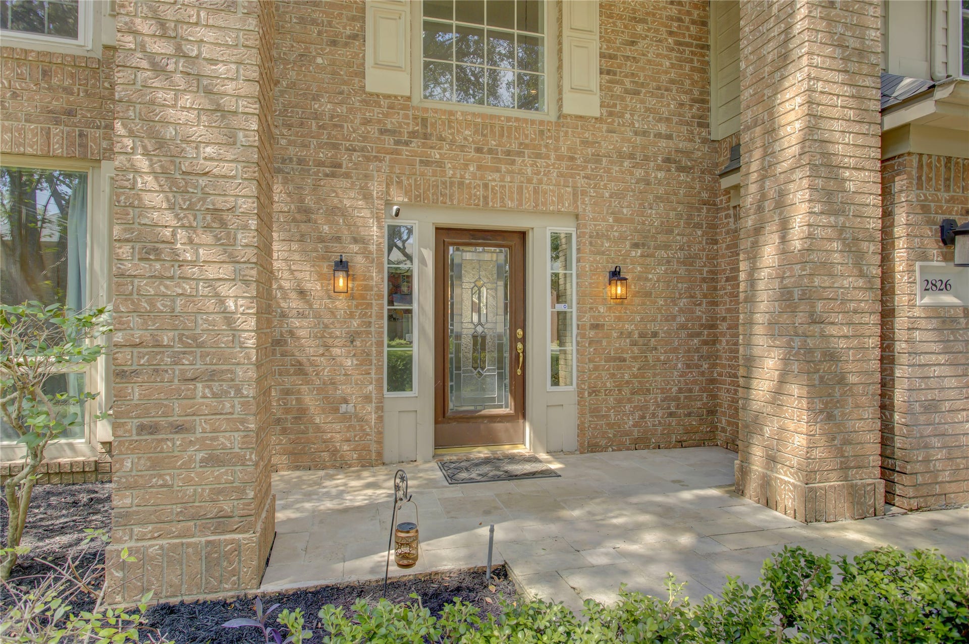 2826 Spring Lakes, Missouri City, TX 77459 Step onto the covered stone porch and through a leaded-glass front door that lets the morning light spill in.