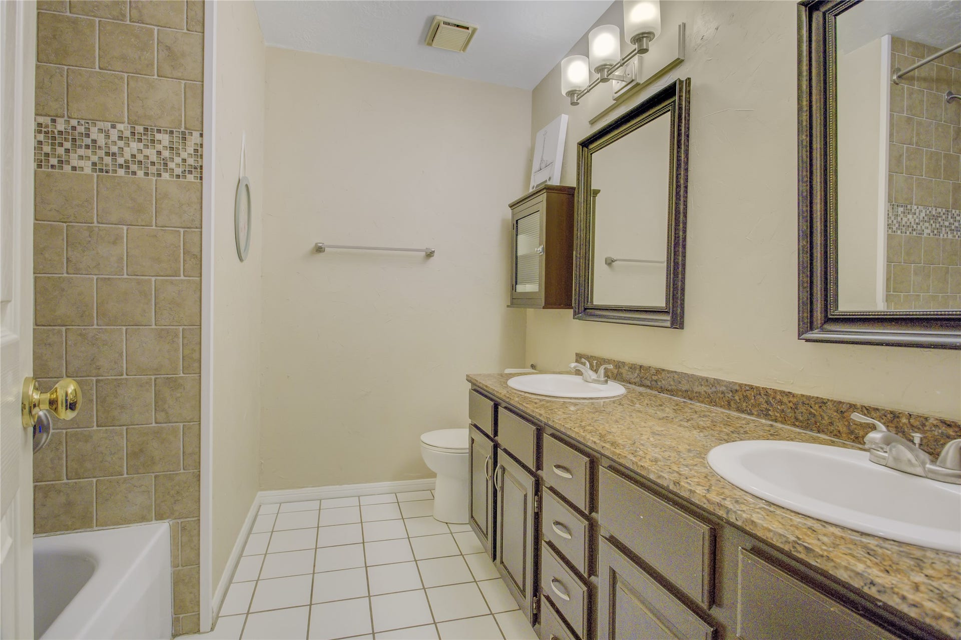 2826 Spring Lakes, Missouri City, TX 77459 The hall bath has double sinks and granite counters, which makes busy school mornings a little easier.