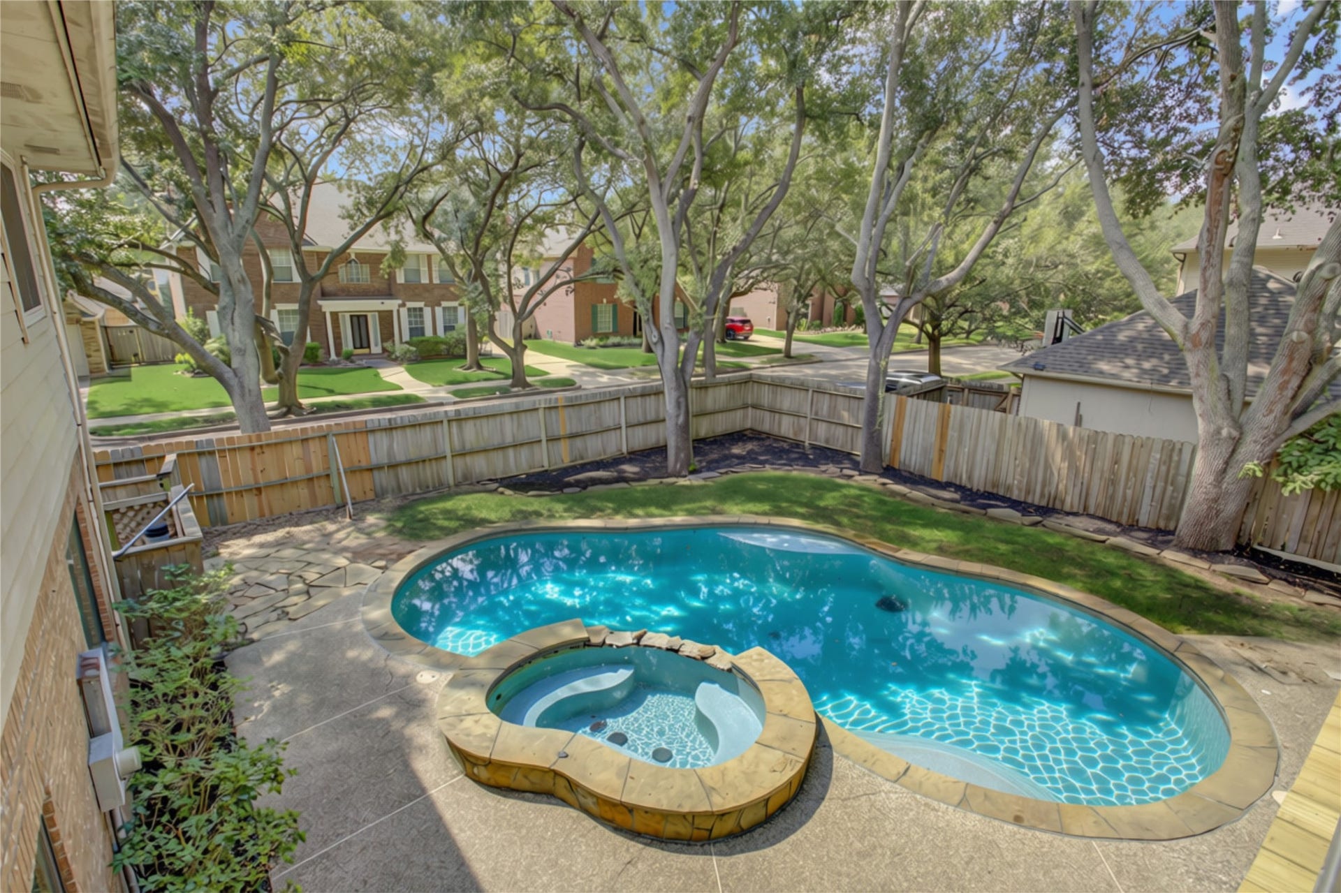2826 Spring Lakes, Missouri City, TX 77459 Views over the treetops of this gorgeous backyard make it feel like your own little escape, right in the neighborhood.