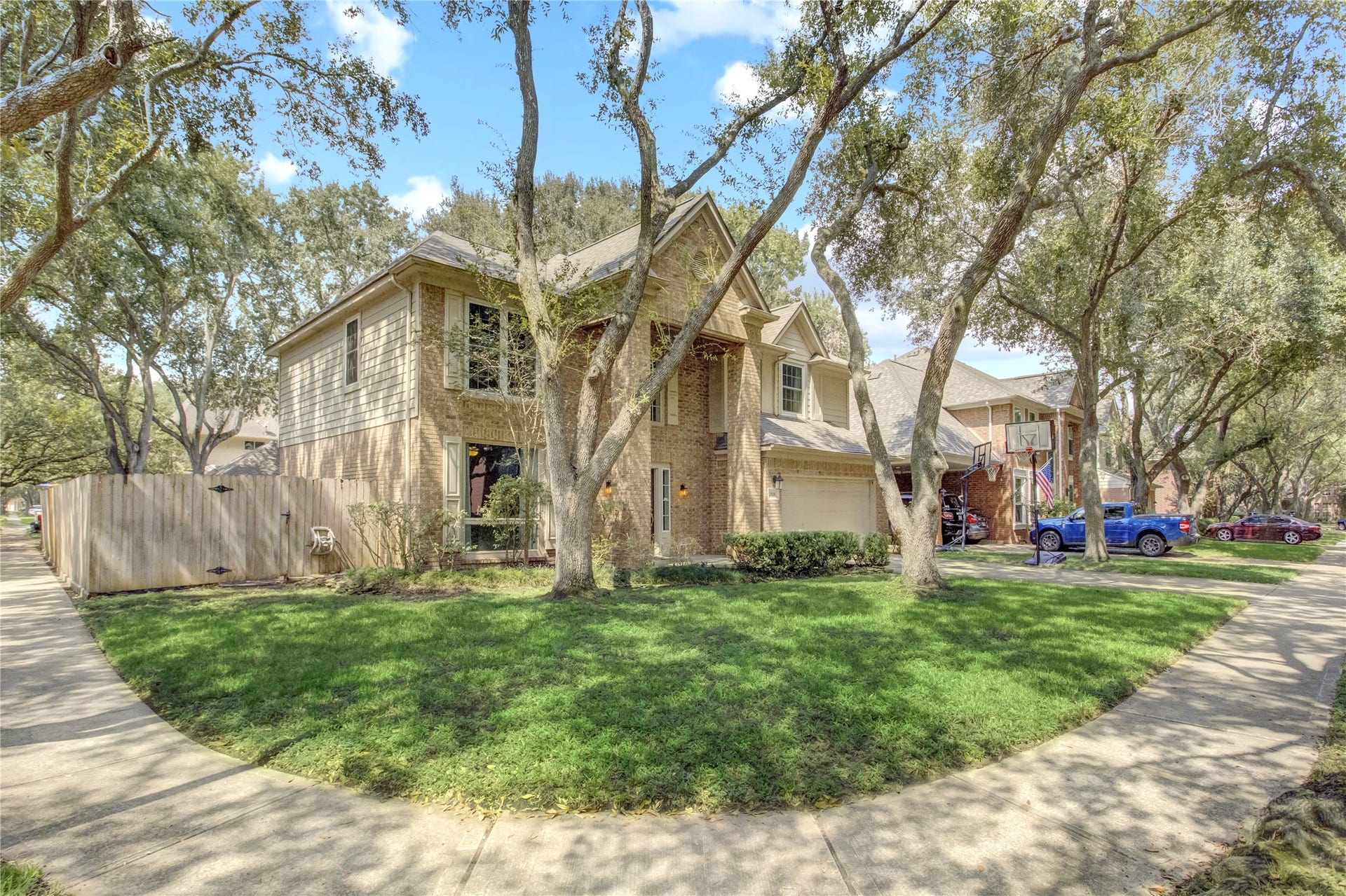 2826 Spring Lakes, Missouri City, TX 77459 The corner lot gives you extra breathing room, with a side yard fenced for privacy and shaded by beautiful mature trees.