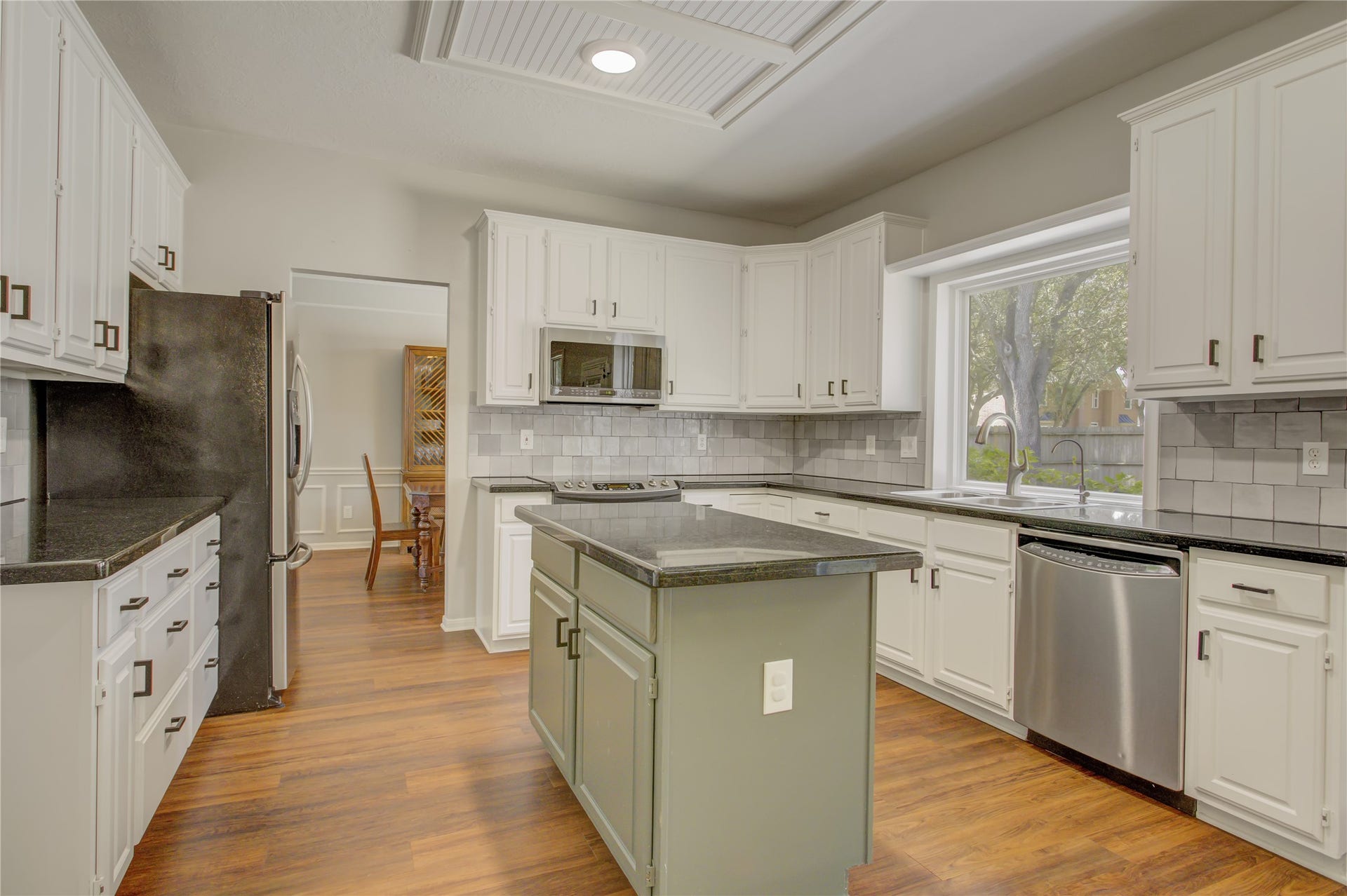 2826 Spring Lakes, Missouri City, TX 77459 The kitchen opens to the family room, so whoever's cooking stays part of the conversation, with a window over the sink looking out to the backyard.