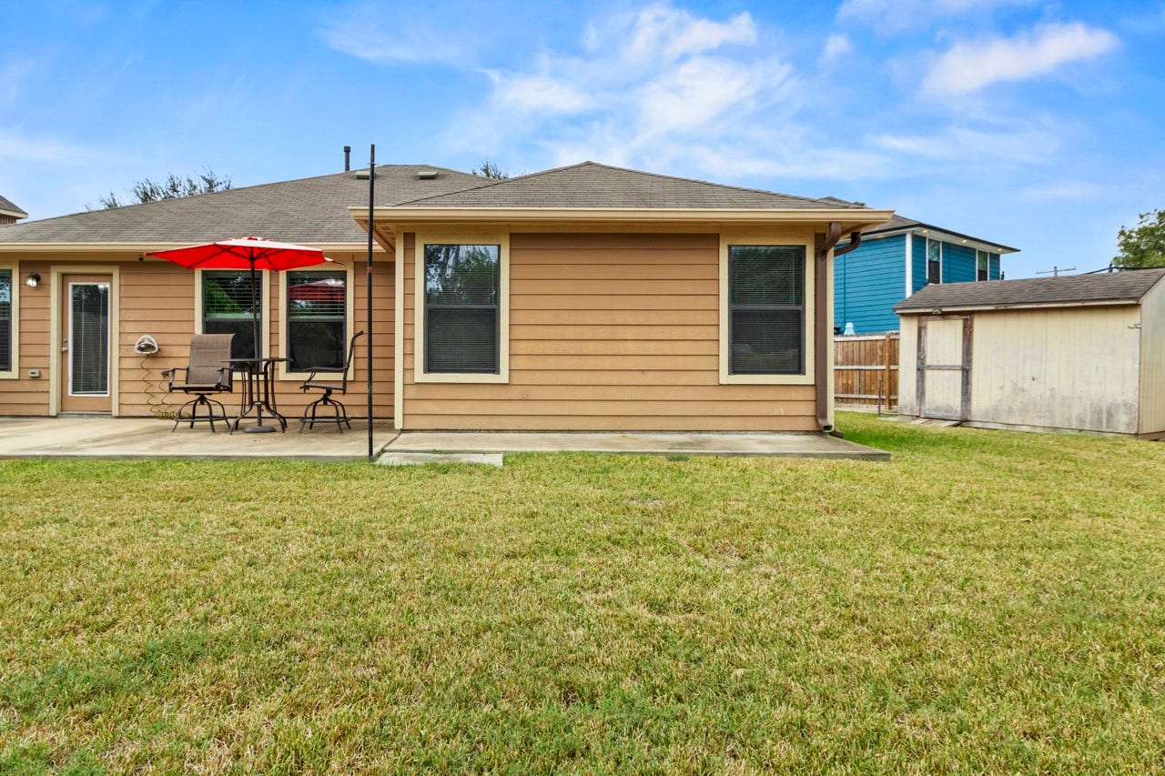 683 Fallow Lane, Alvin, TX 77511 Back of Home with Shed for all your outdoor storage