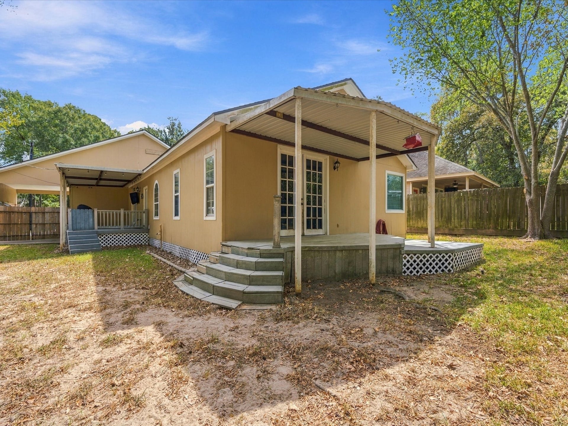 306 Sherwood Forest Street, Conroe, TX 77316 The expansive backyard provides plenty of room for outdoor activities, entertaining or simply enjoying the space.