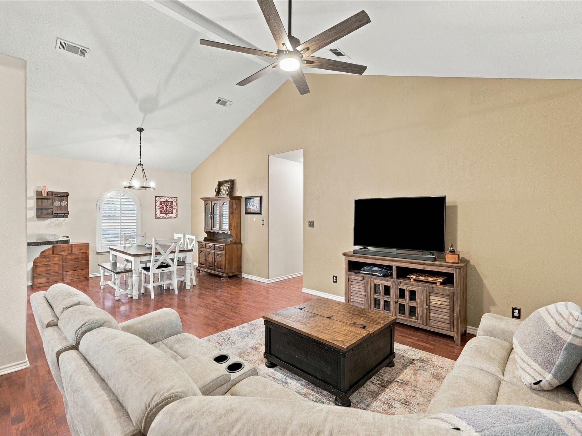 306 Sherwood Forest Street, Conroe, TX 77316 The open-concept layout connects the dining area & kitchen to the family room for easy flow between living spaces.