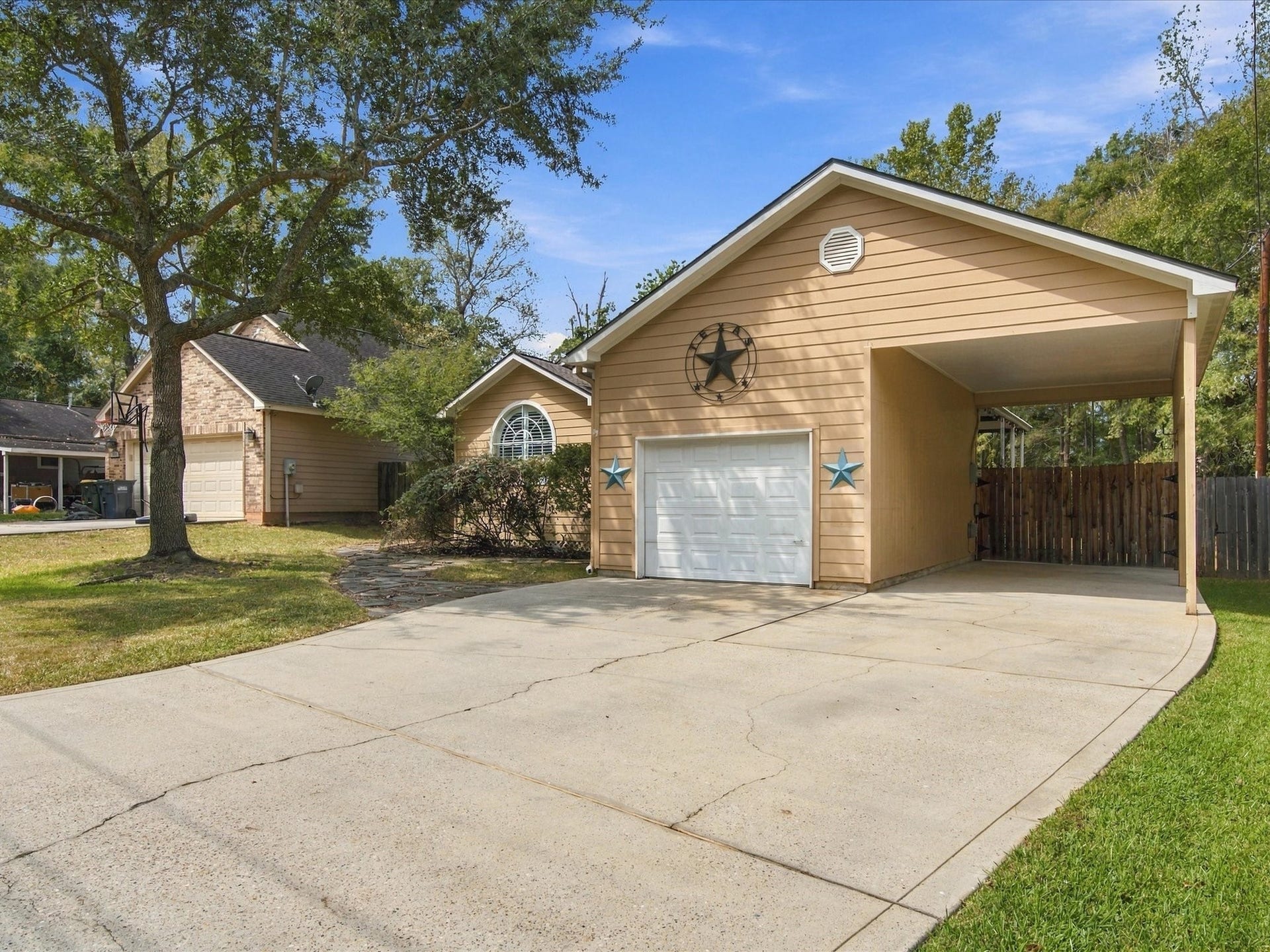 306 Sherwood Forest Street, Conroe, TX 77316 The attached carport provides valuable covered parking with plenty of room for an RV, boat or trailer.
