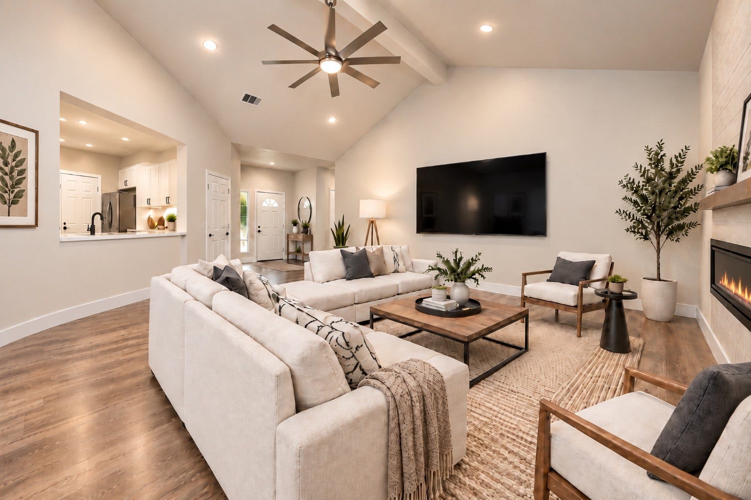 Spacious living area with vaulted ceilings, sleek ceiling fan, and elegant wood flooring, offering a bright and inviting atmosphere. AI Generated