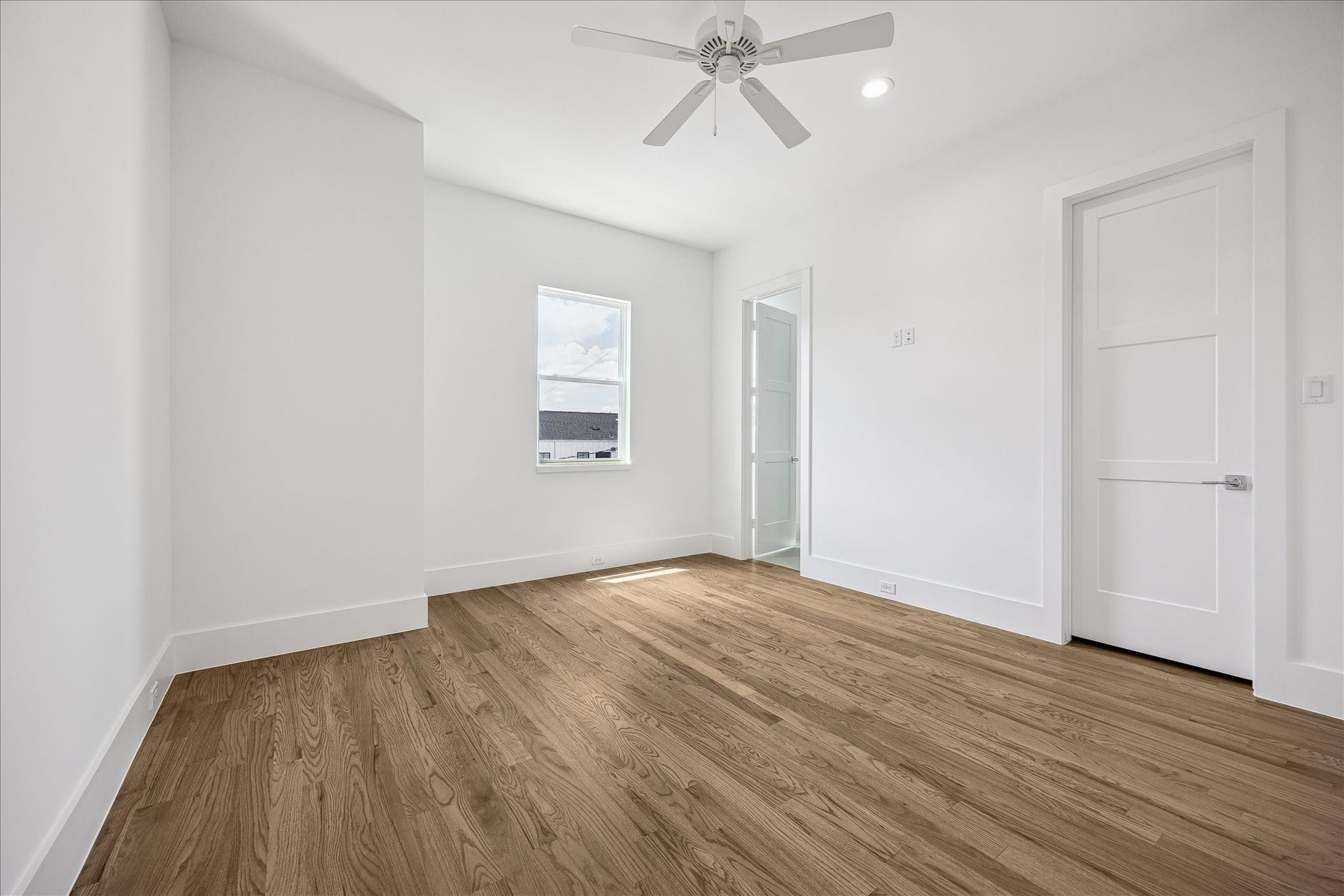 310 Fowler Street, Houston, TX 77007 Spacious secondary bedroom filled with natural light and hardwoods continued.