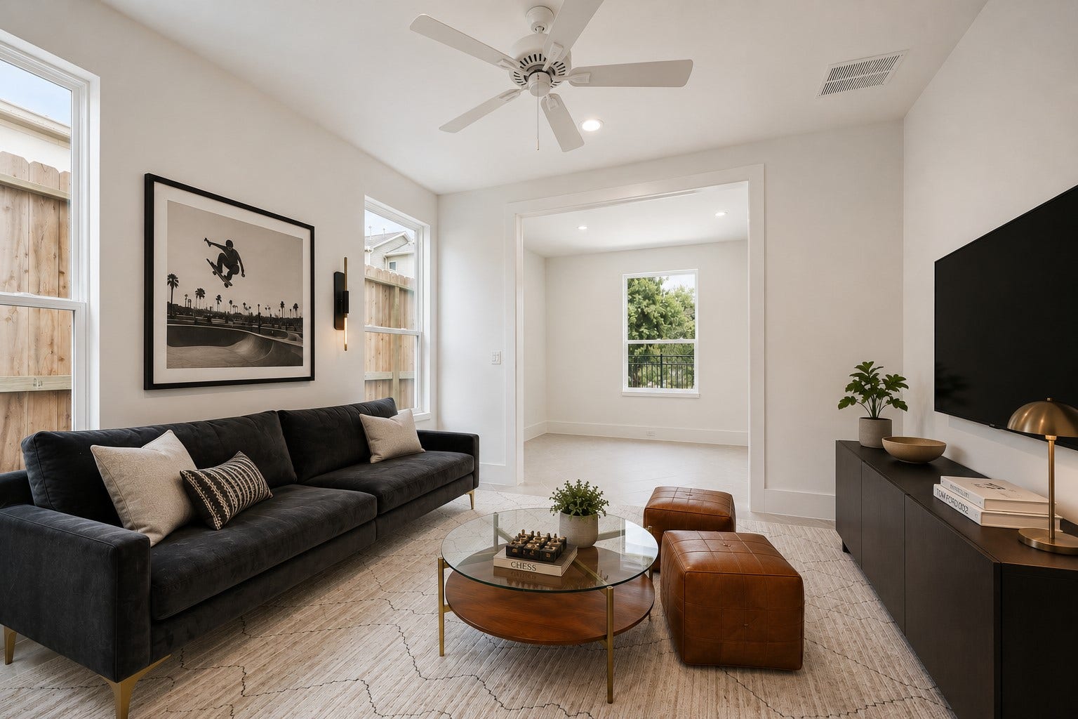 310 Fowler Street, Houston, TX 77007 A generously sized third bedroom. Currently staged as a game room/second living space the perfect flexible secondary bed. A digitally enhanced image.