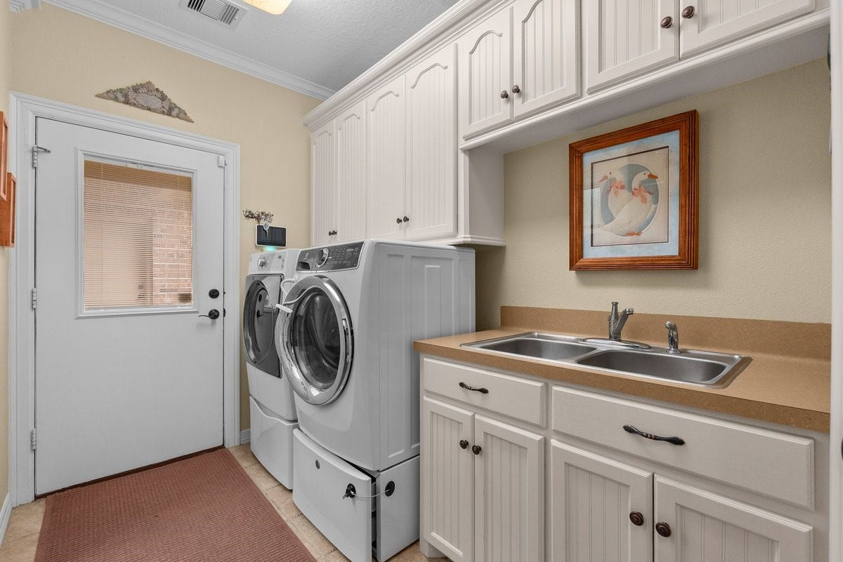 1303 China Grove Drive, Rosharon, TX 77583 Laundry room that leads to the carport area,
