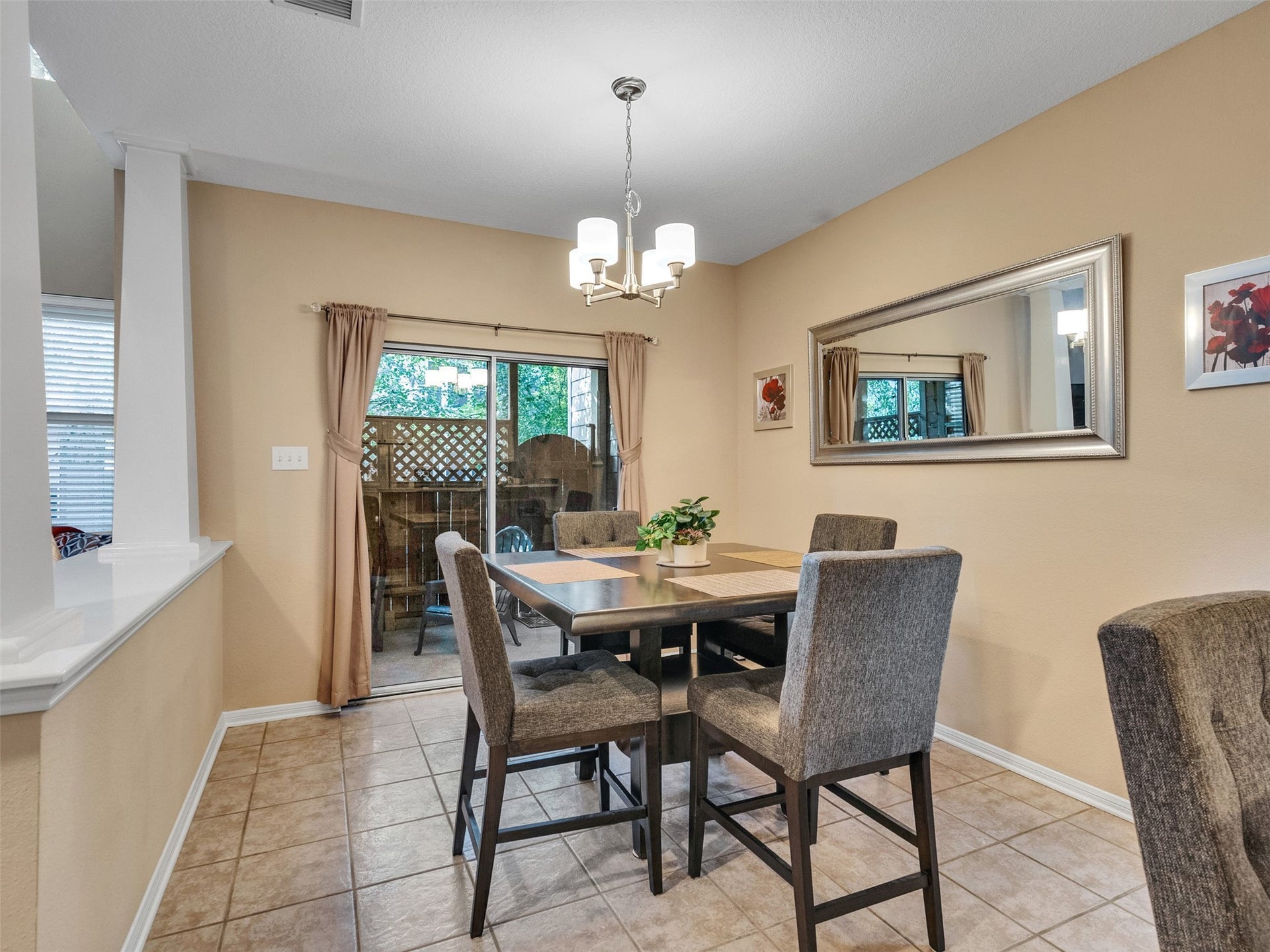 83 Scarlet Woods Court, #83, The Woodlands, TX 77380 Dining area seats 4 with additional seating at the bar counter.