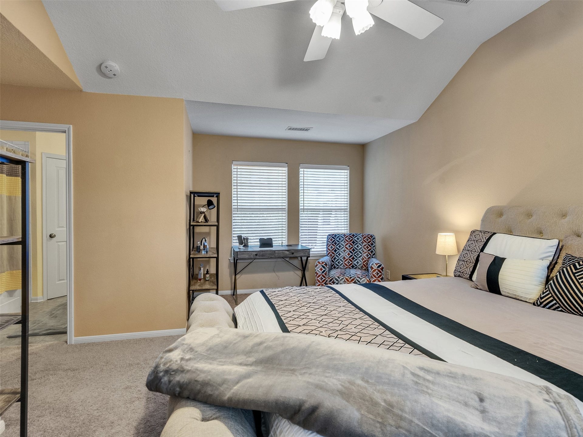 83 Scarlet Woods Court, #83, The Woodlands, TX 77380 Additional sitting area with a writing desk and cozy chair in the primary bedroom for last minute thoughts or early morning reflection.