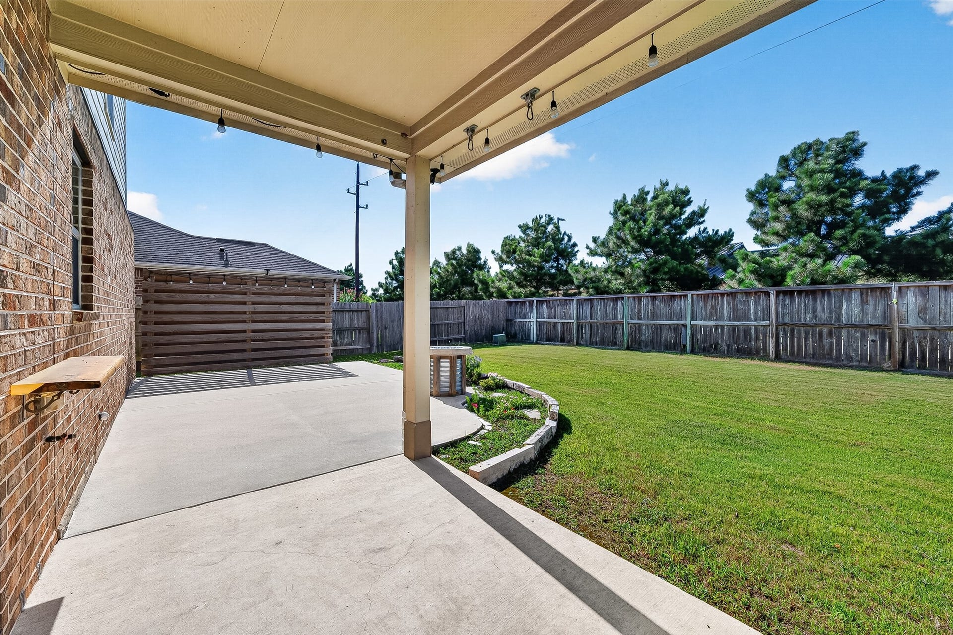 23010 Tindarey Falls Lane, Katy, TX 77493 extended back patio with a privacy fence