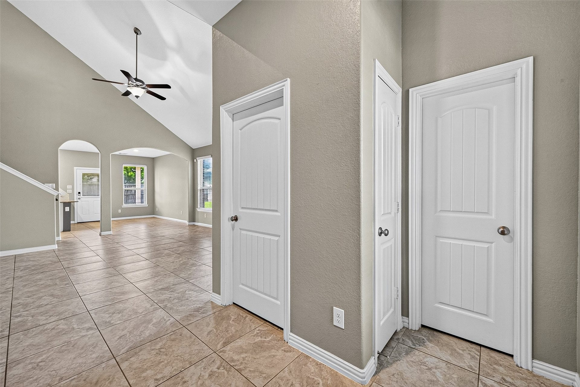 23010 Tindarey Falls Lane, Katy, TX 77493 View from front entry looking towards living room. Door to the right is guest bath, washer and dryer room.
