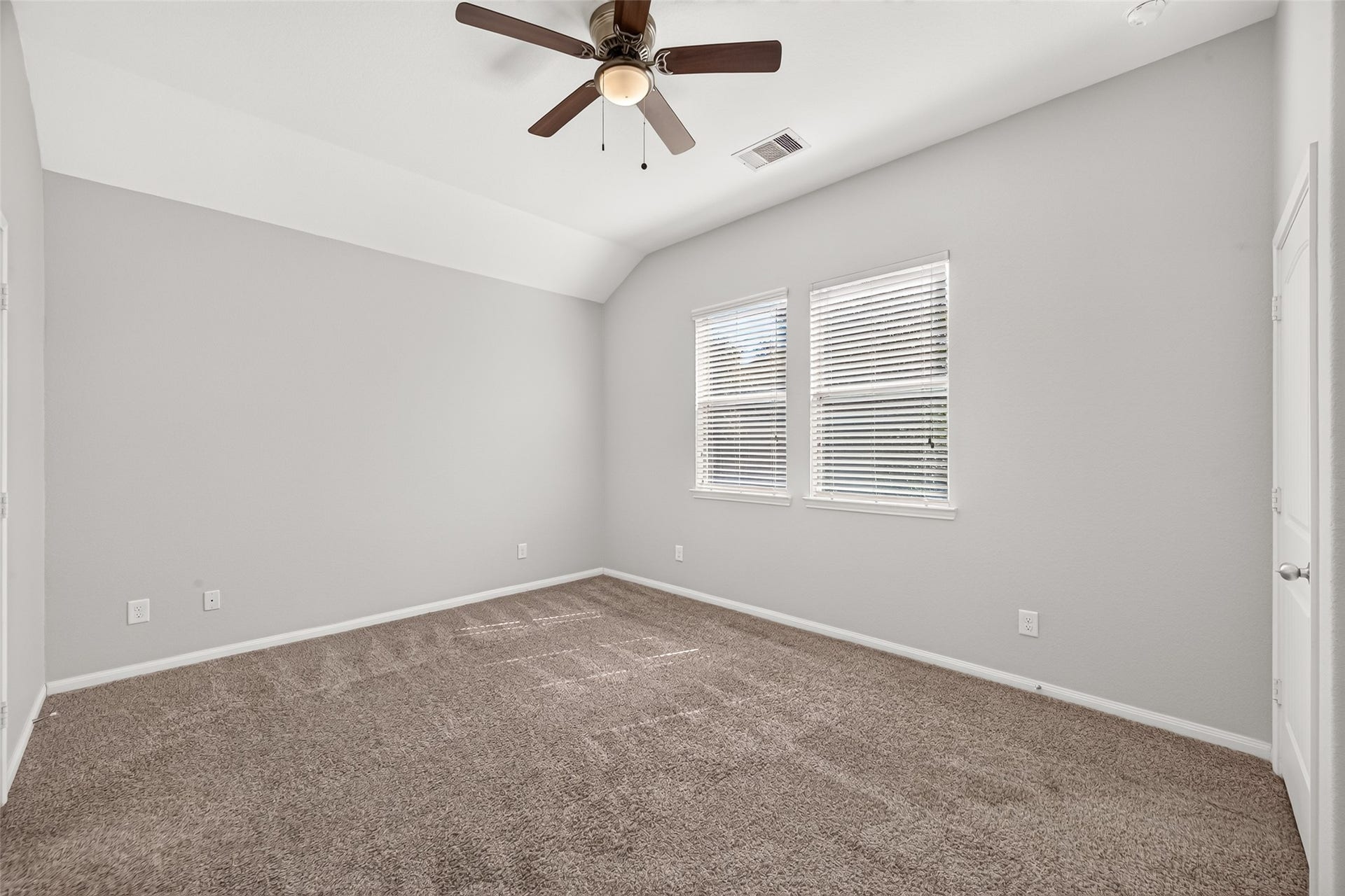 1018 Pleasant Bend, Conroe, TX 77301 Natural light creates a comfortable and peaceful primary bedroom setting.